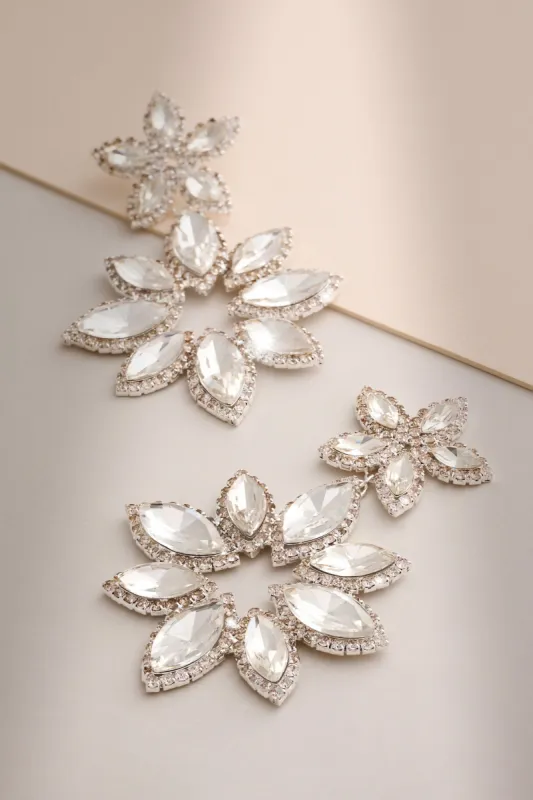 Maura | Silver Diamante Flower Statement Earrings sold by Club L London