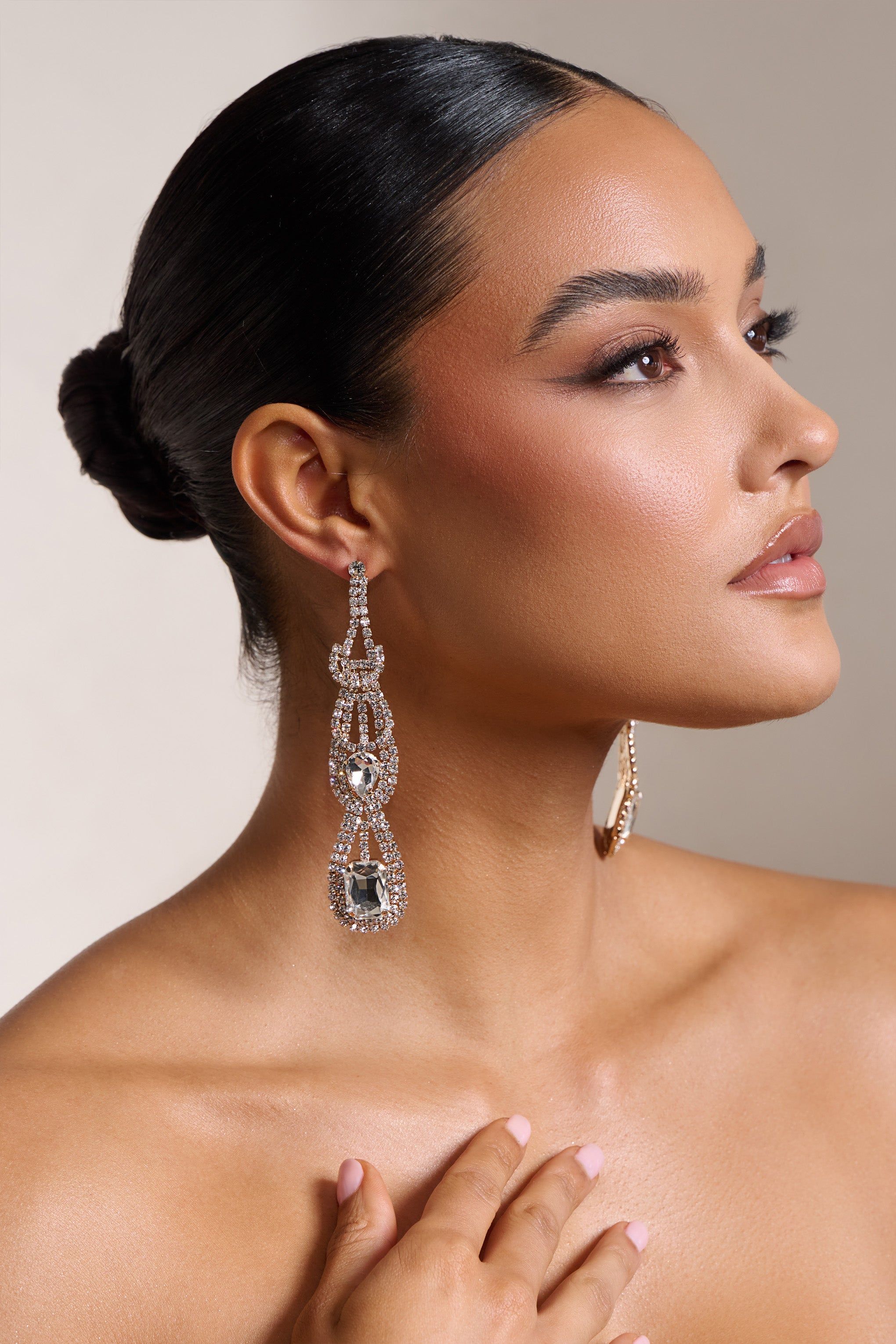 Rita | Gold Diamante Statement Drop Earrings sold by Club L London