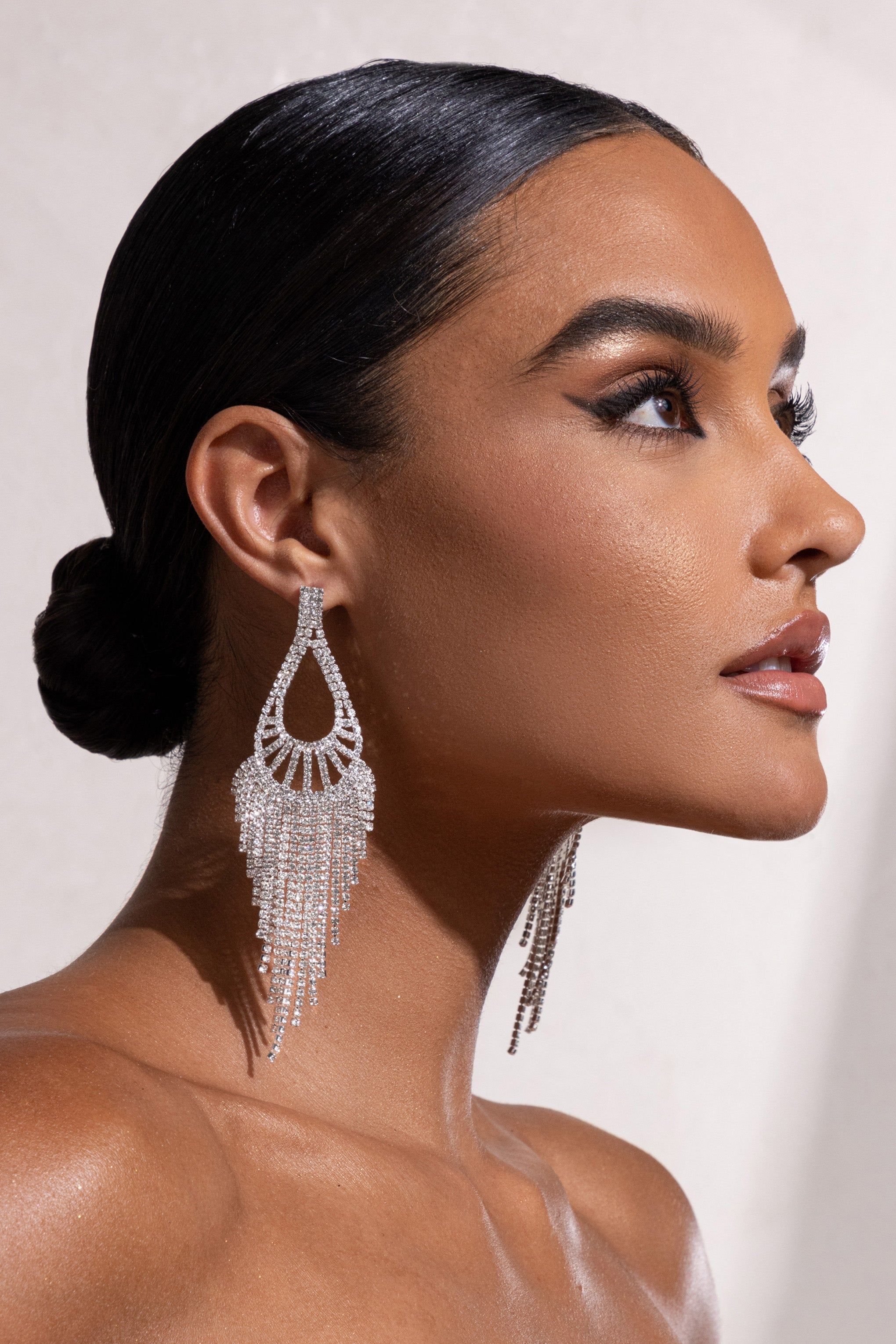 Alessia | Silver Diamante Teardrop Tassel Earrings sold by Club L London