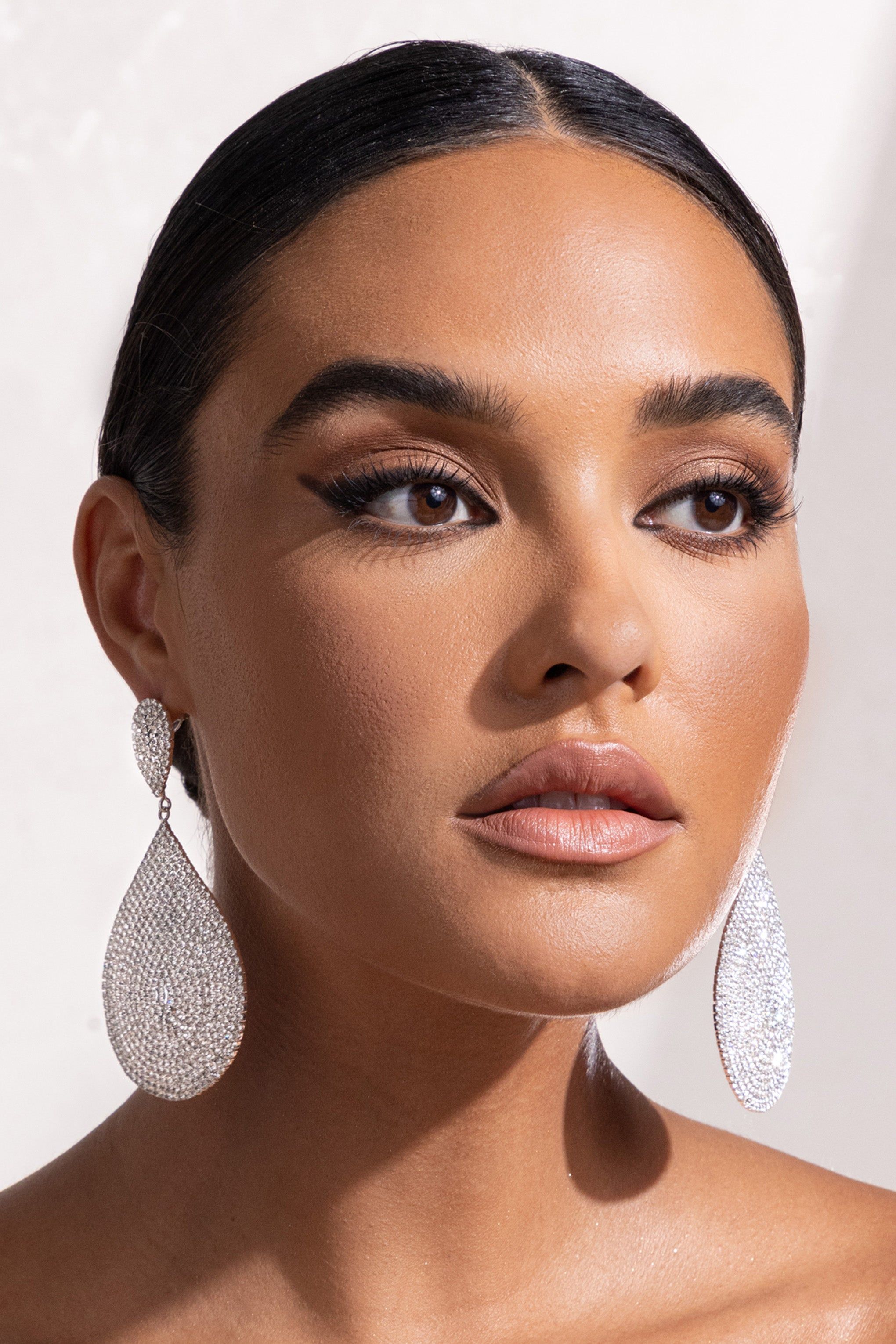Lucia | Silver Diamante Teardrop Drop Earrings sold by Club L London