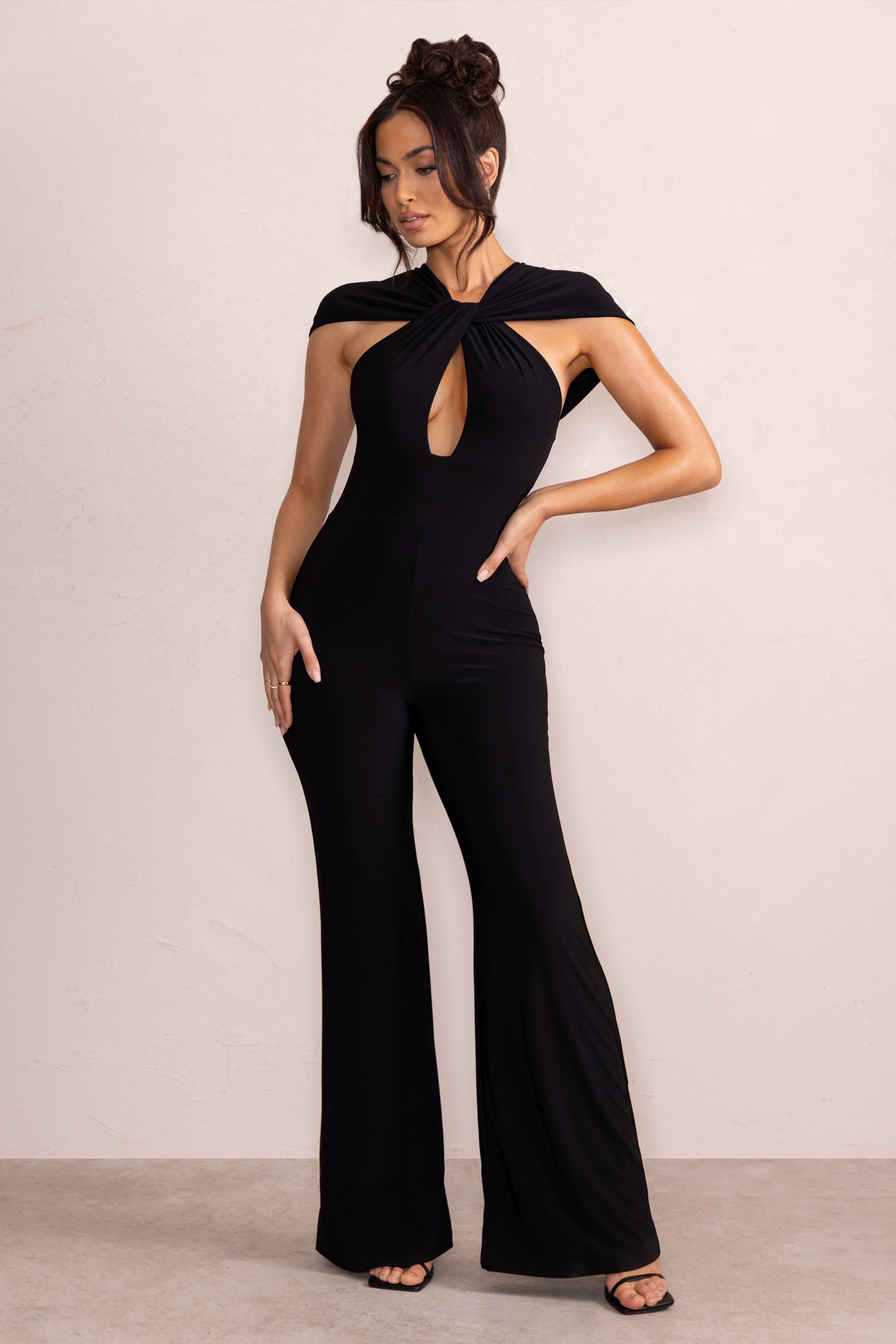 Irie | Black Twist Neck Cut Out Wide Leg Jumpsuit sold by Club L London