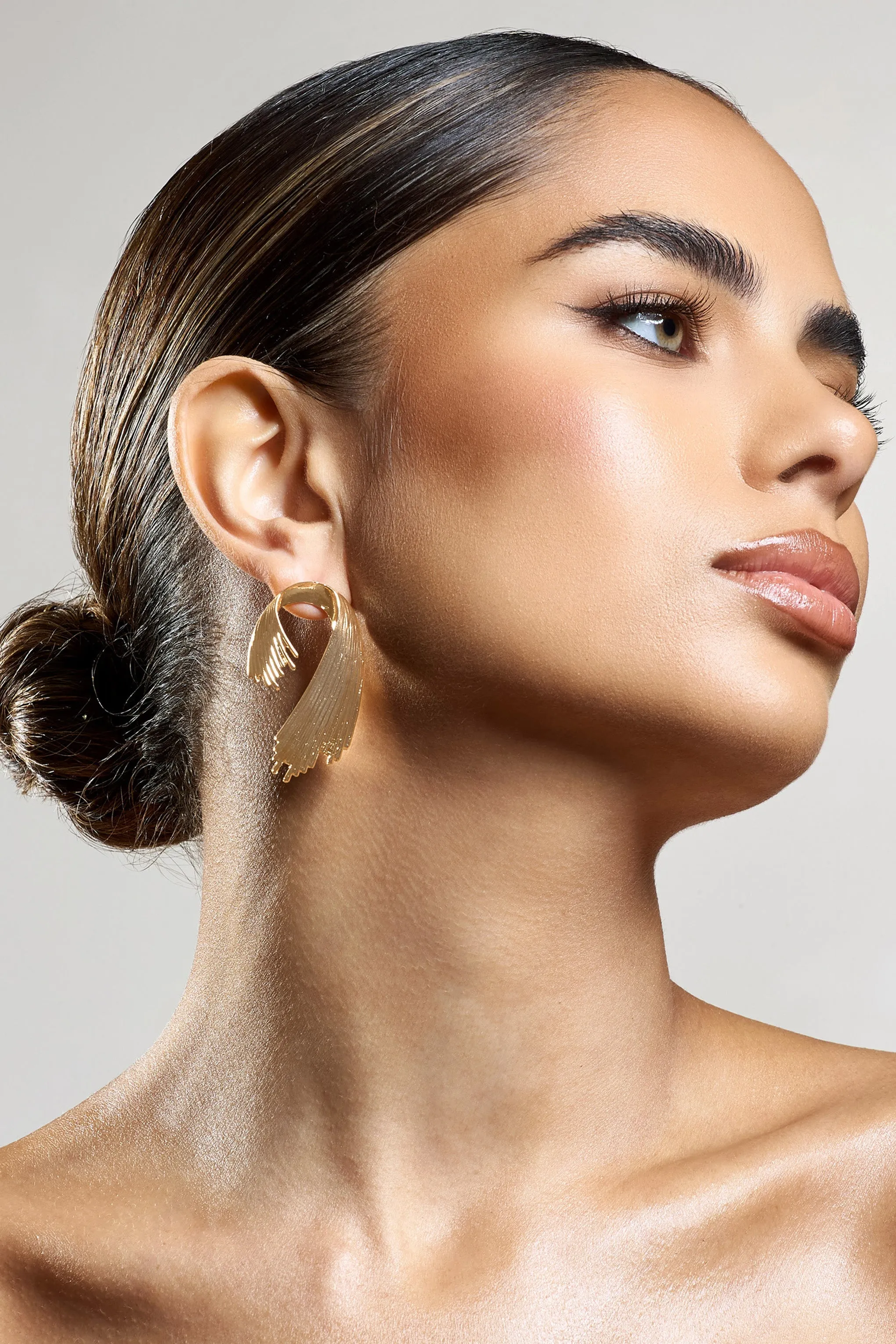 Marcela | Gold Ribbed Abstract Dangle Earrings sold by Club L London product image thumbnail 4
