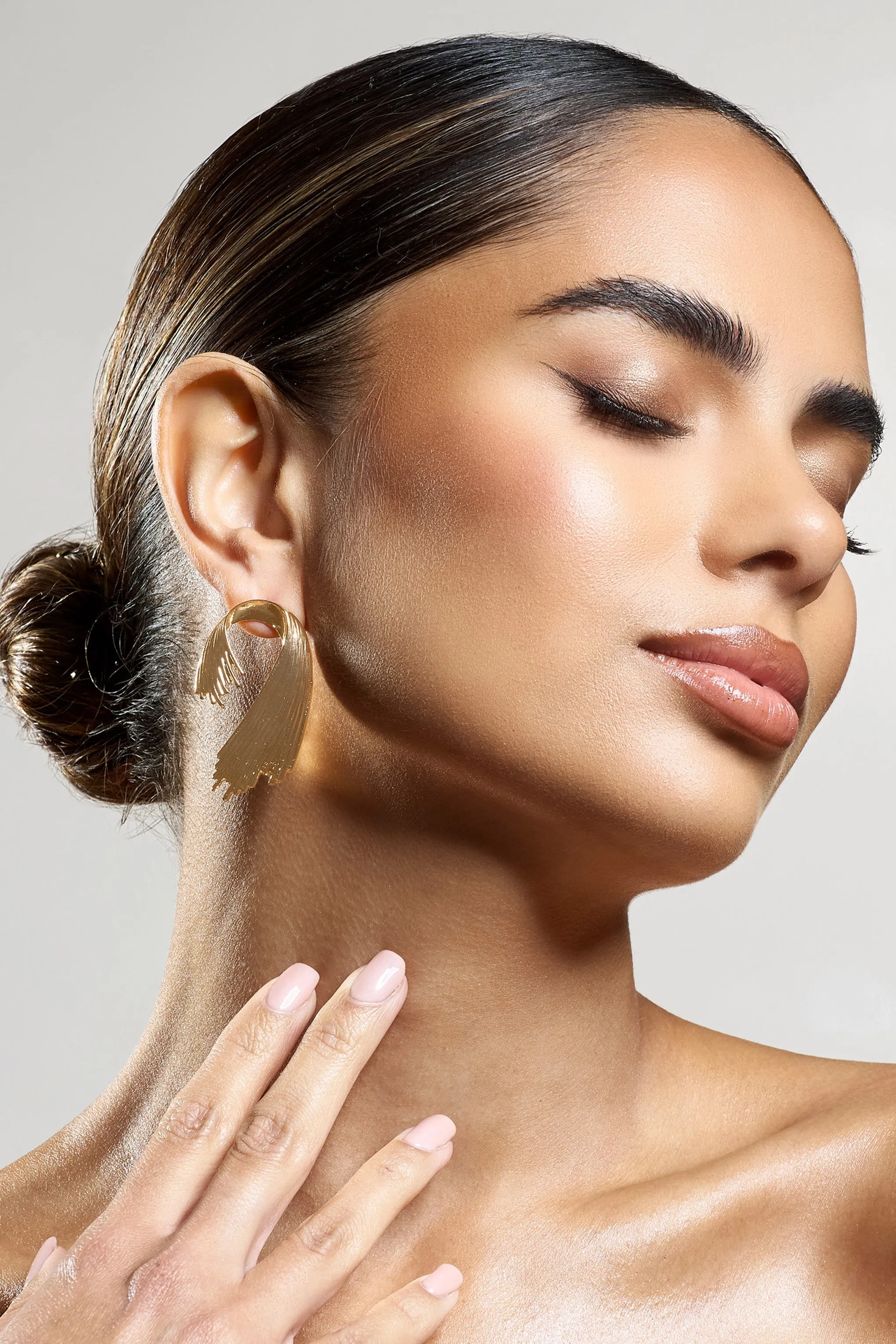 Marcela | Gold Ribbed Abstract Dangle Earrings sold by Club L London product image thumbnail 2