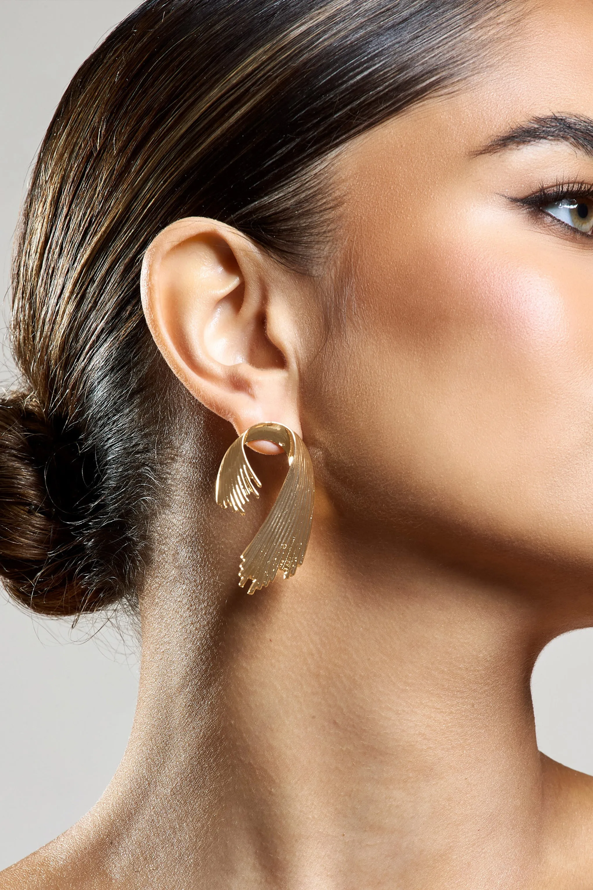 Marcela | Gold Ribbed Abstract Dangle Earrings sold by Club L London product image thumbnail 3