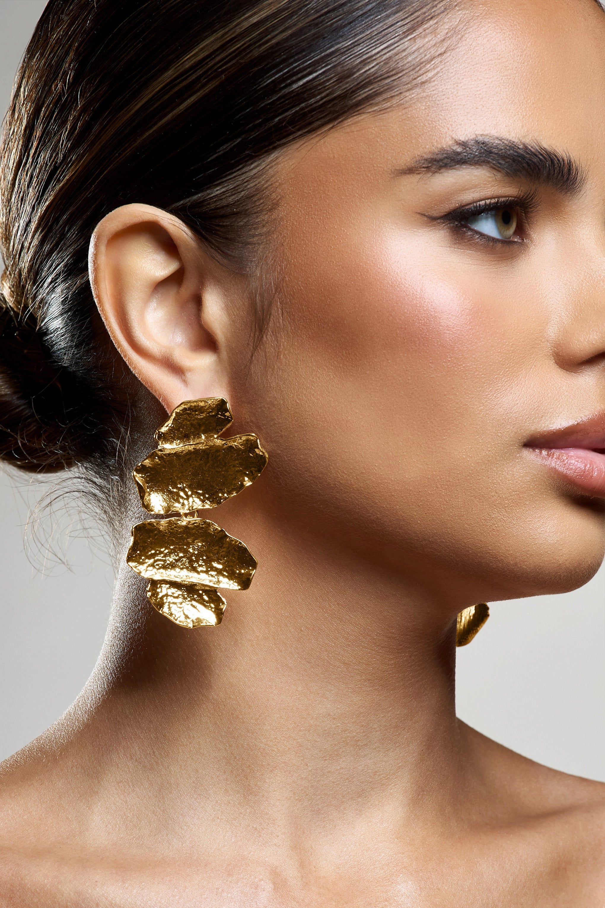 Sierra Madre | Gold Textured Abstract Drop Earrings sold by Club L London product image thumbnail 4