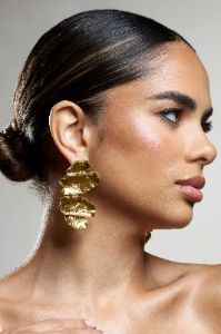 Sierra Madre | Gold Textured Abstract Drop Earrings sold by Club L London
