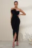 High Class | Black Bandeau Thigh Split Maxi Dress With Feather Trim sold by Club L London