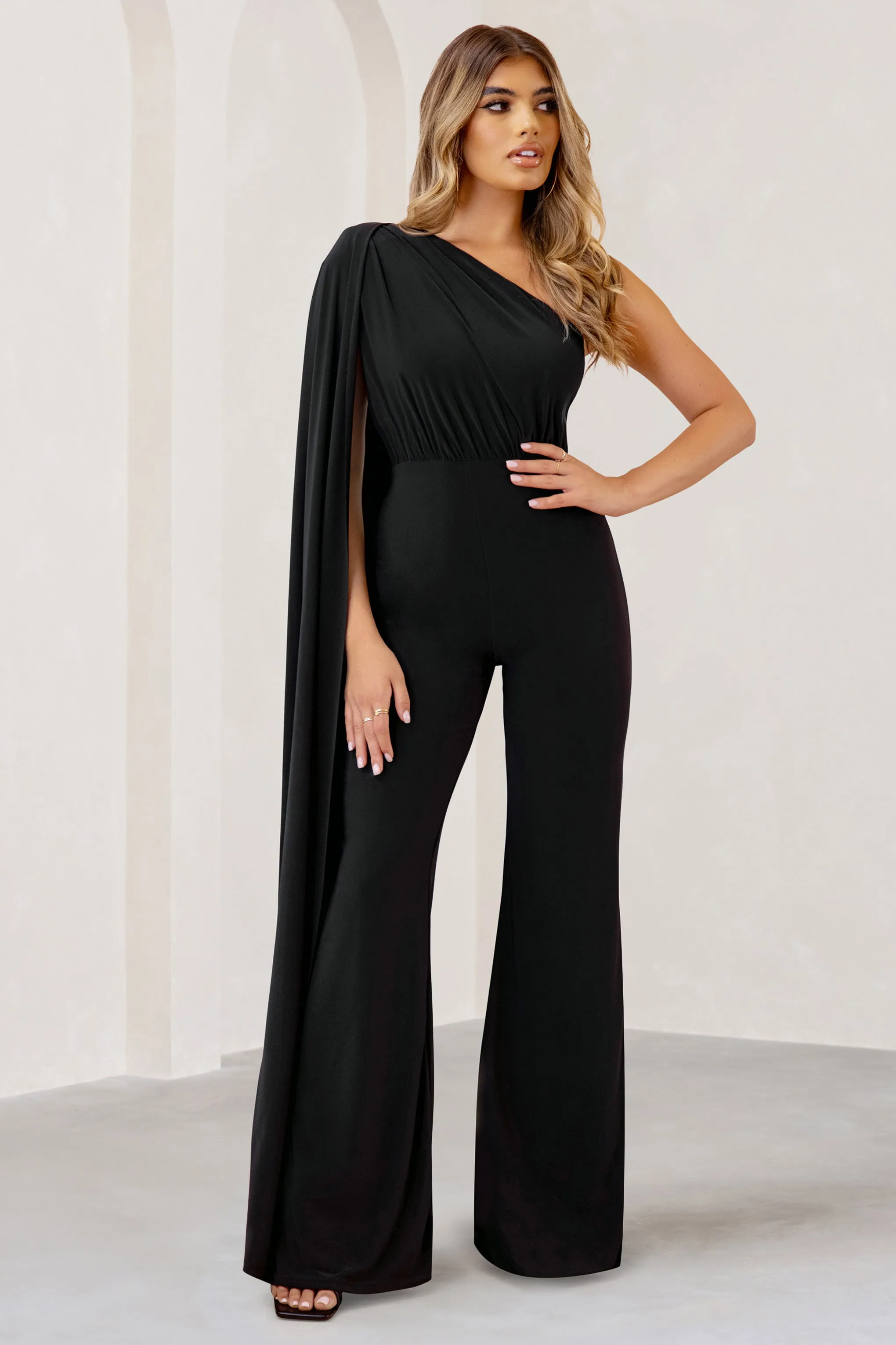 Aurora | Black One Shoulder Cape Sleeve Jumpsuit sold by Club L London