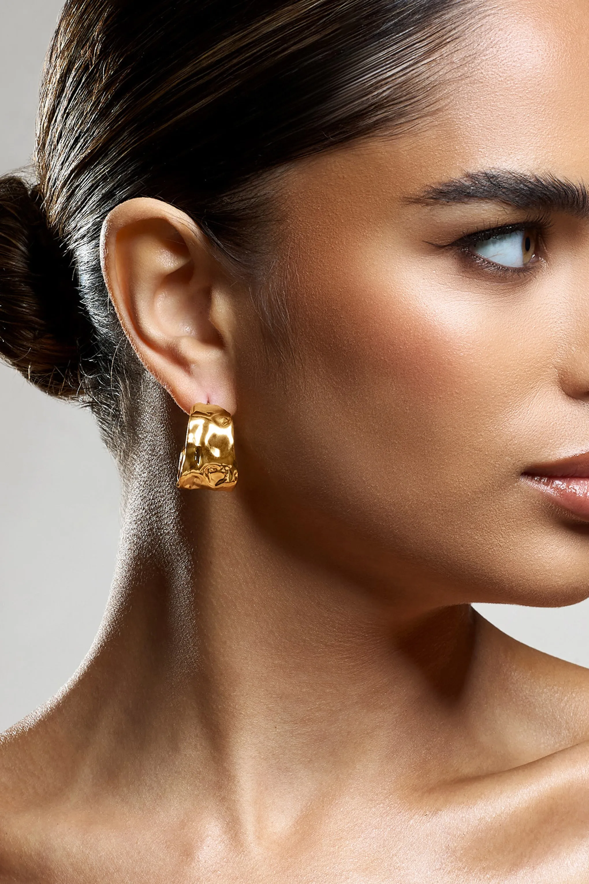 Kiki | Gold Hoop Earrings With Hammered Finish sold by Club L London