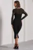 Between The Lines | Black Ruched Mesh Long-Sleeved Bodycon Midi Dress sold by Club L London