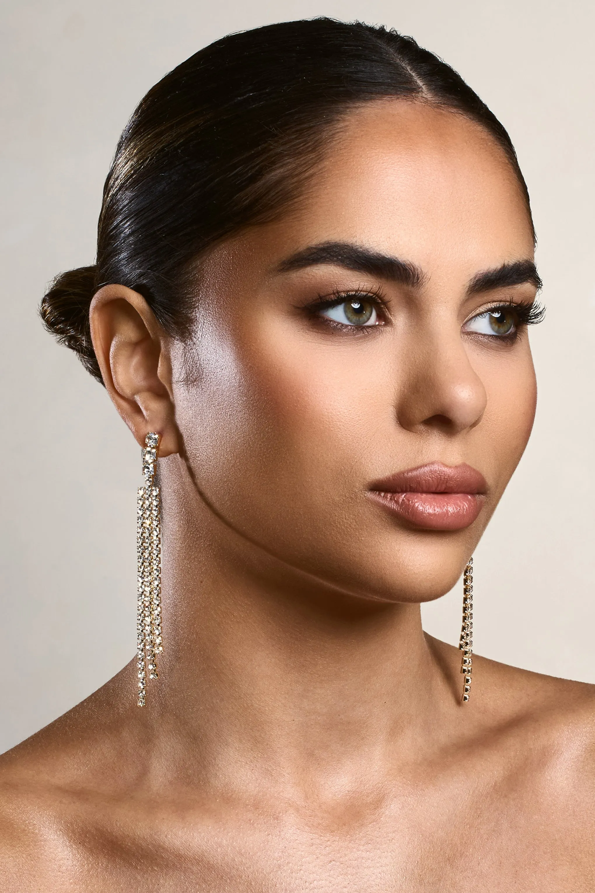 Glint | Gold Diamante Tassel Earrings sold by Club L London