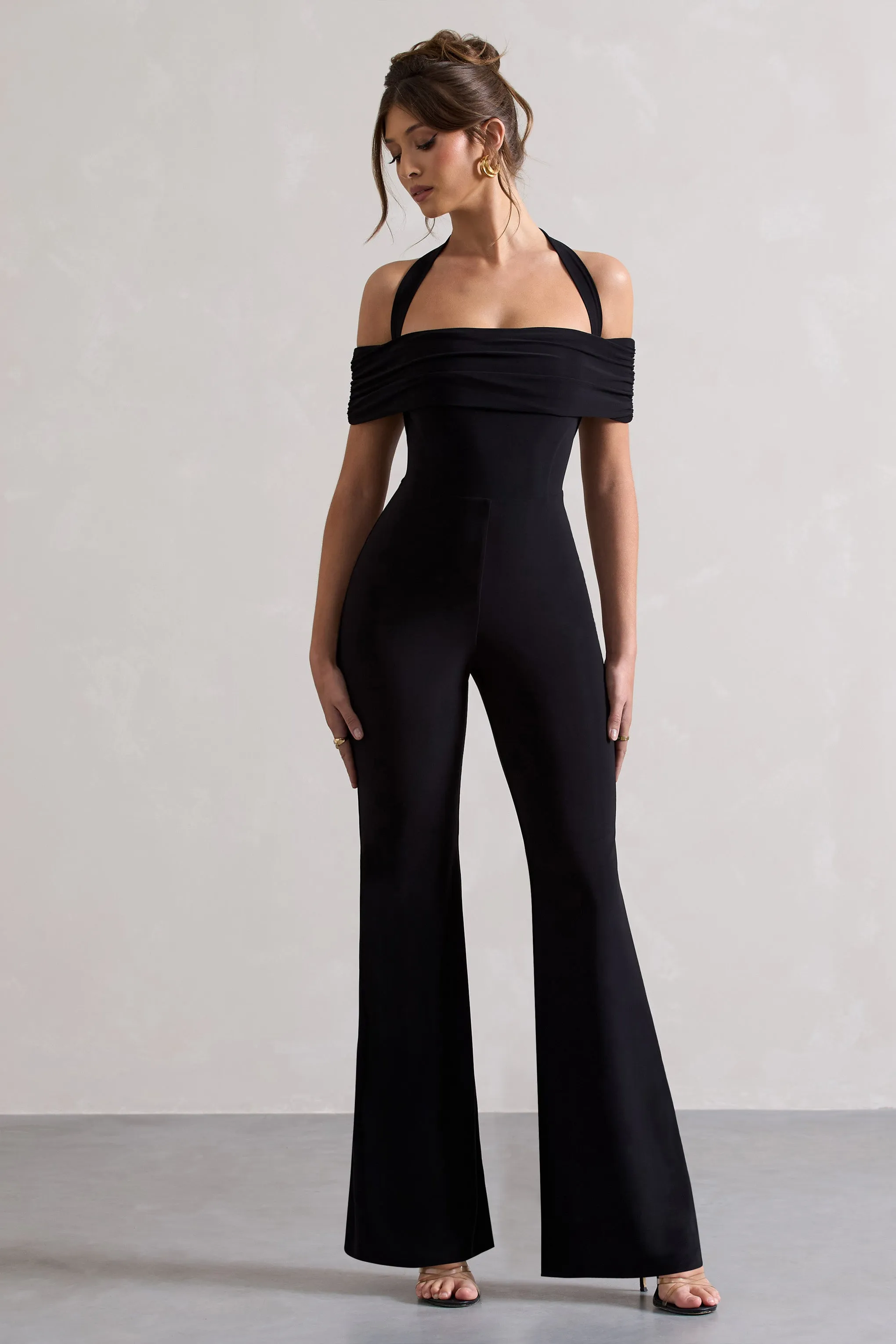 Mara | Black Bardot Halter-Neck Flared-Leg Jumpsuit sold by Club L London