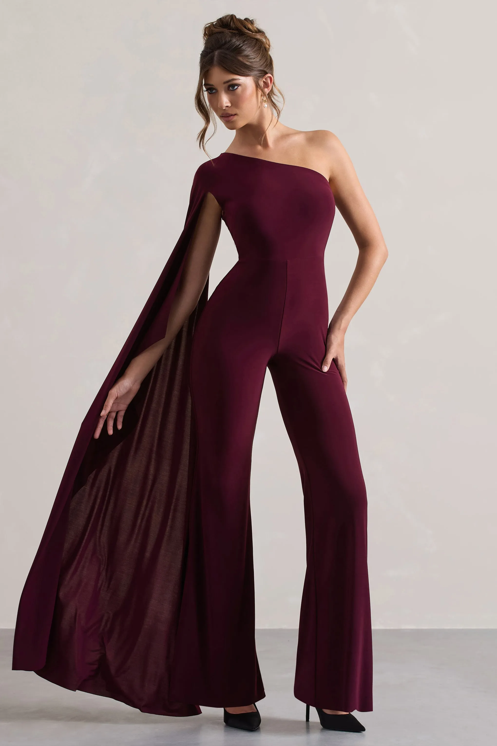 Julie | Plum Asymmetric Flared-Leg Jumpsuit With Cape Sleeve sold by Club L London