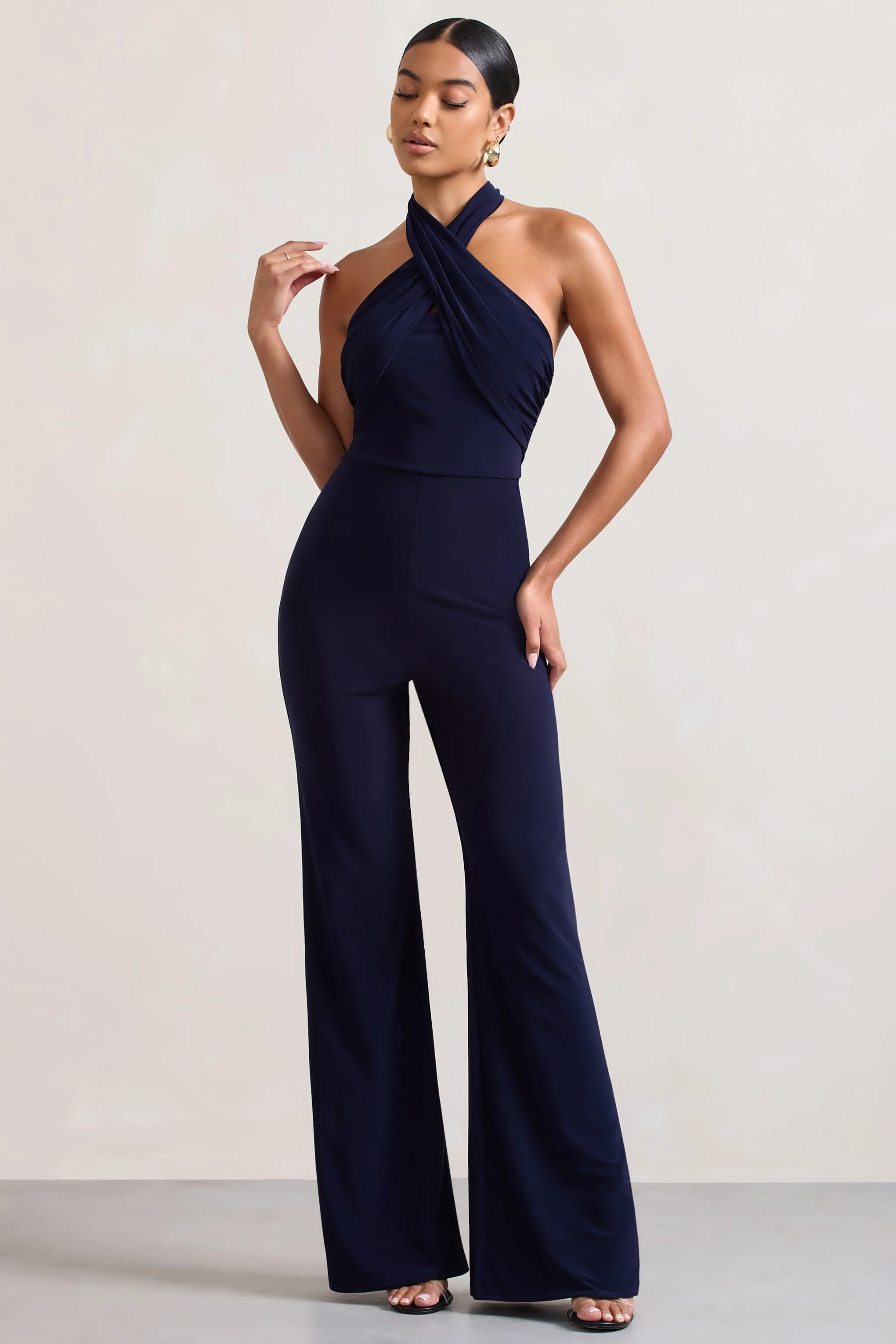 Goddess | Navy Halter Neck Flare Jumpsuit sold by Club L London