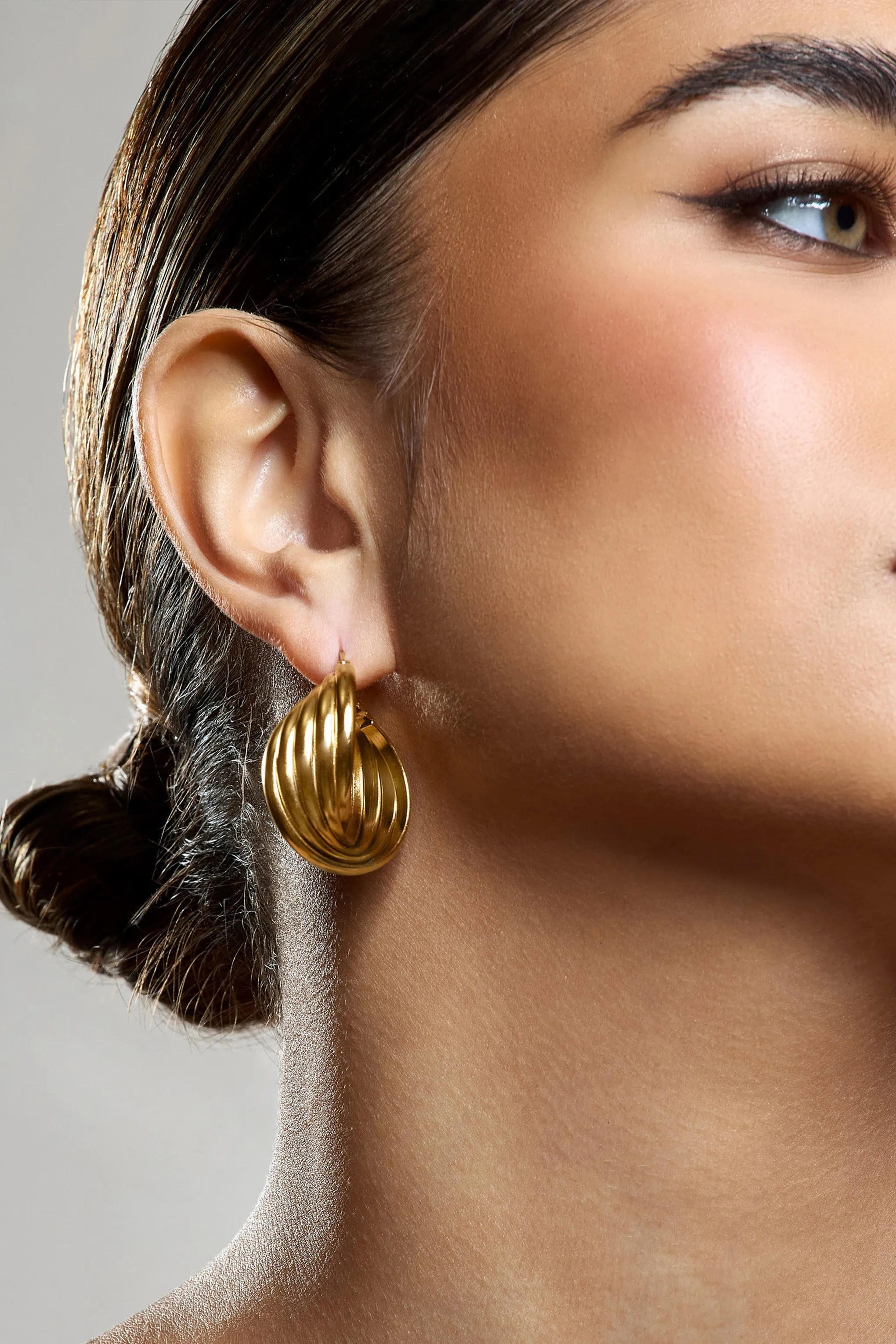 Indigo | Gold Chunky Twisted Hoop Earrings sold by Club L London product image thumbnail 4