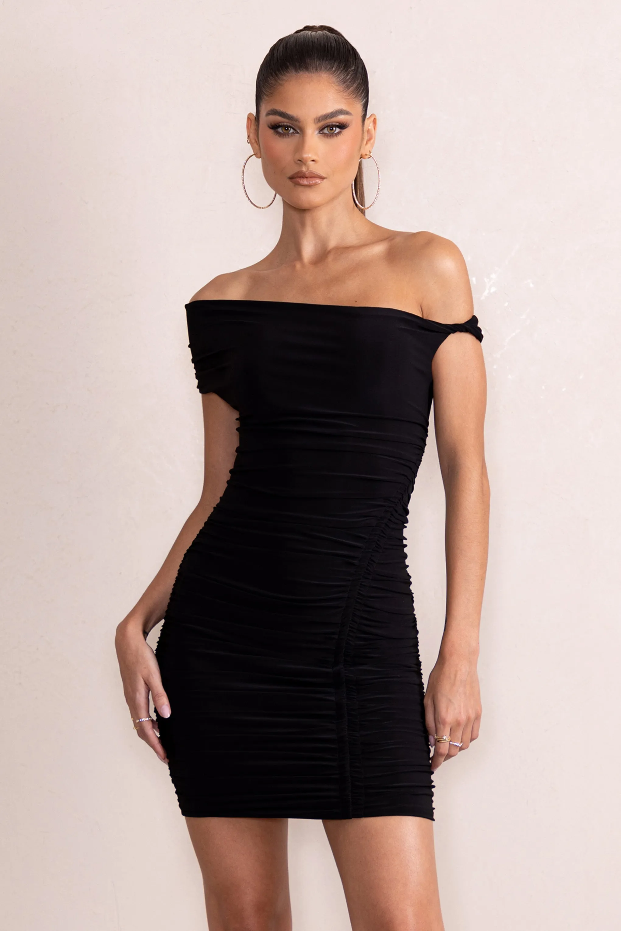 Coco | Black Asymmetric Bardot Mini Dress With Ruching Detail sold by Club L London