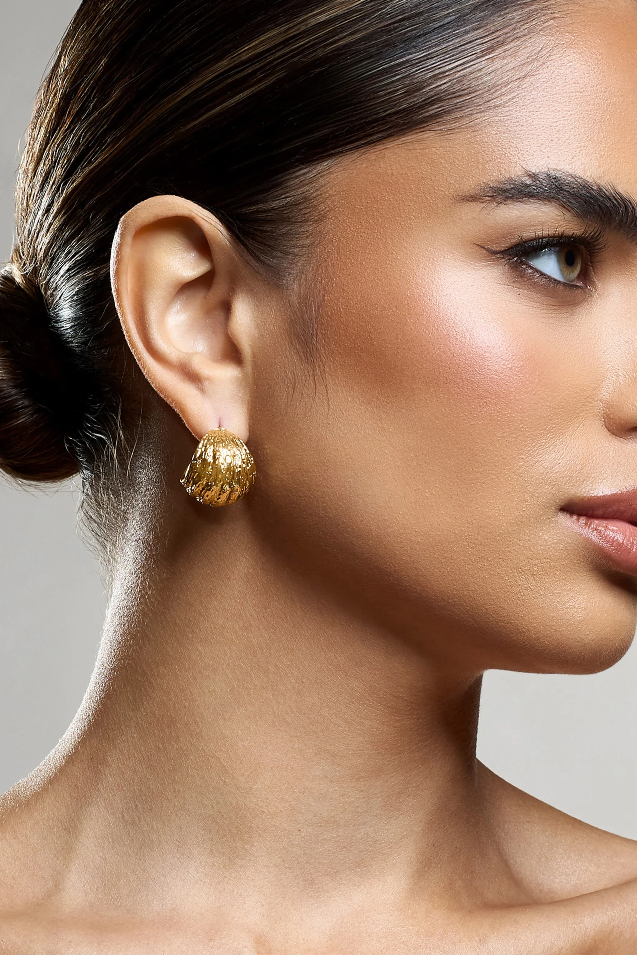 Christabel | Gold Textured Huggie Earrings sold by Club L London