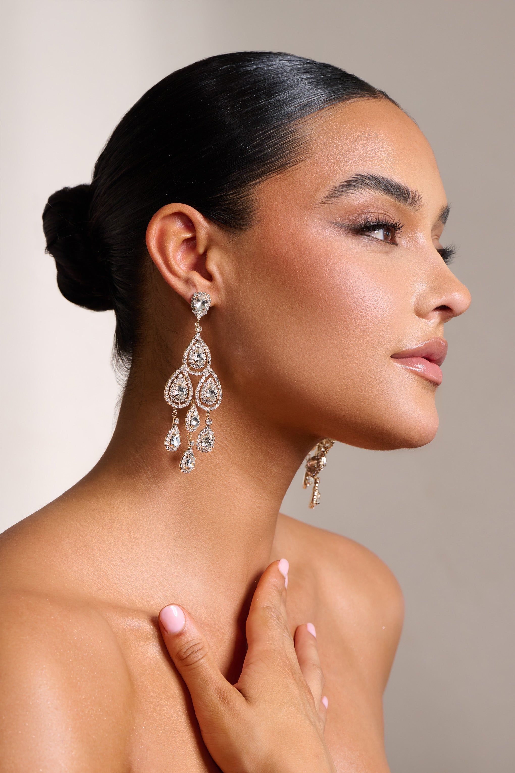 Trixie | Gold Crystal Candelier Earrings sold by Club L London