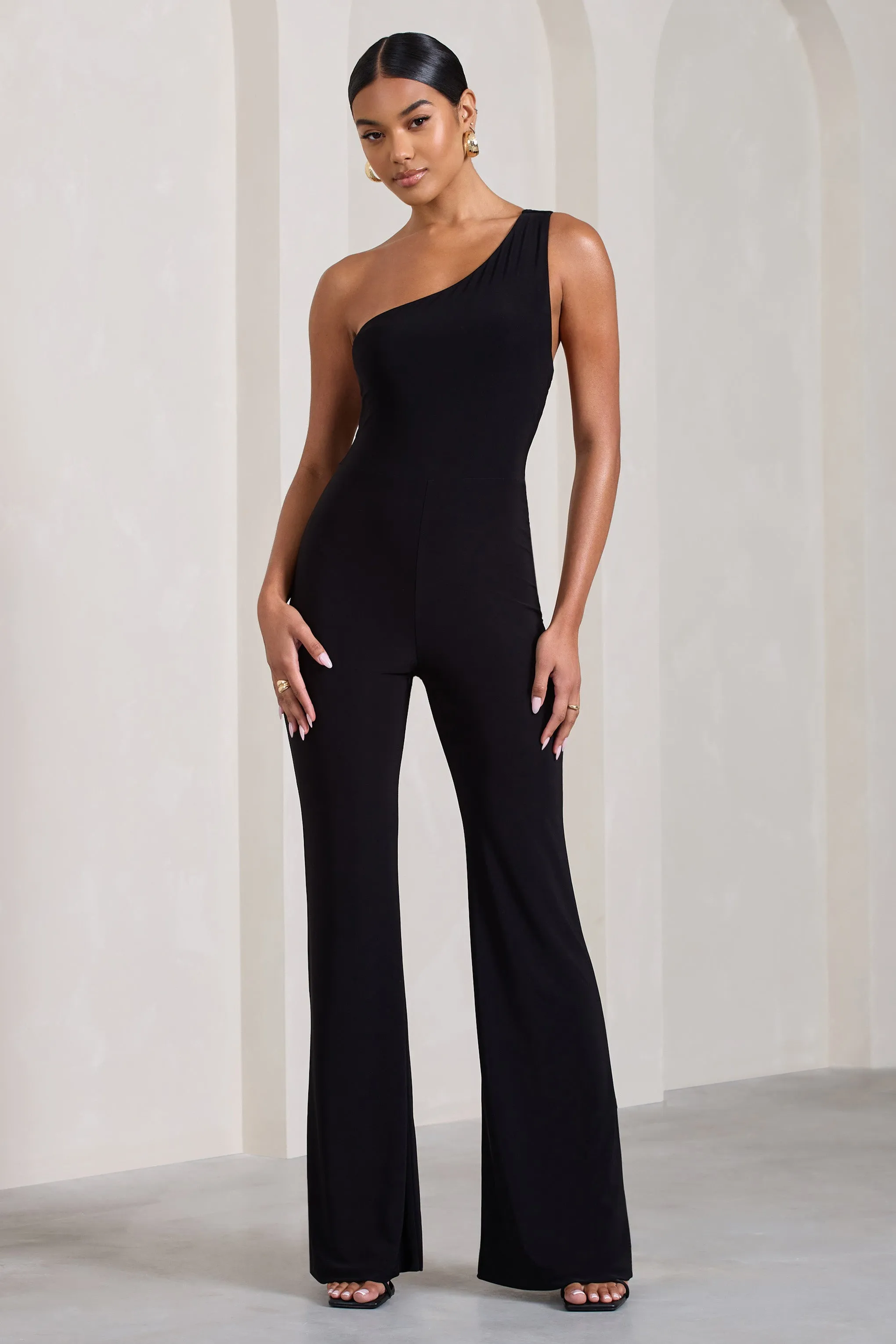 In The Dark | Black Sleeveless Asymmetric Flared-Leg Jumpsuit sold by Club L London