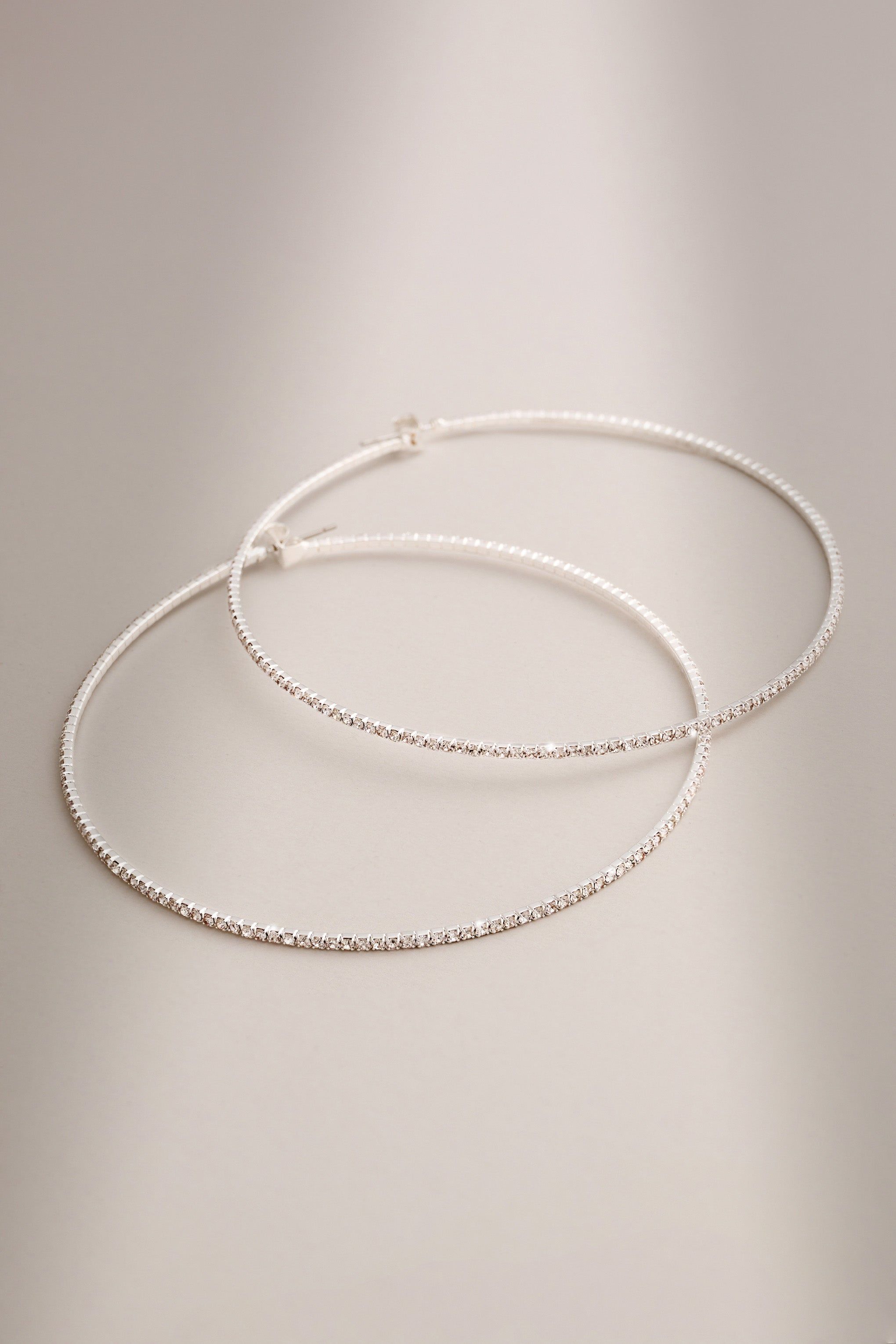 Rosey | Silver Diamante Thin Hoop Earrings sold by Club L London product image thumbnail 3