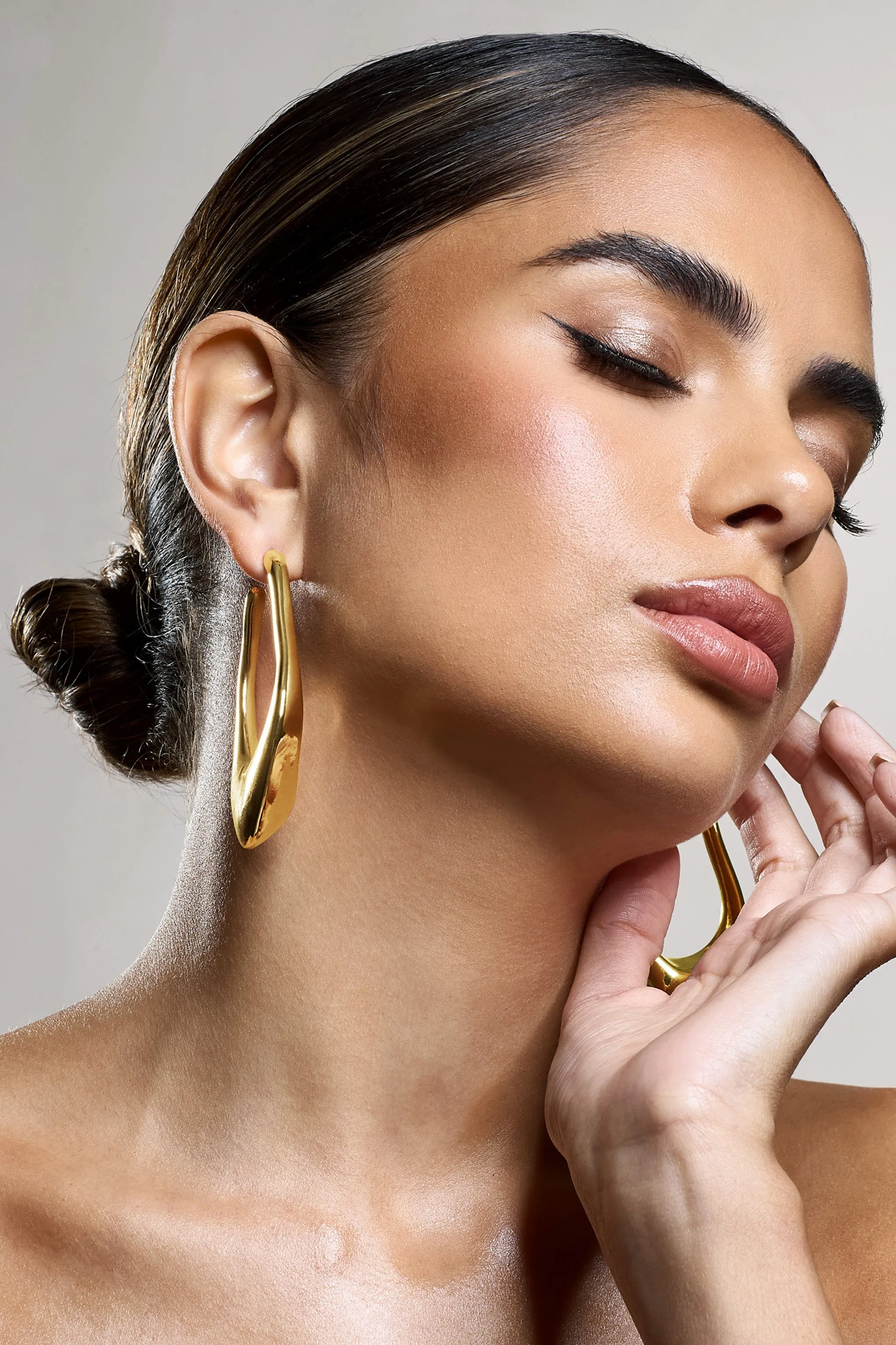 Tanzania | Gold Abstract Dangle Hoop Earrings sold by Club L London product image thumbnail 4
