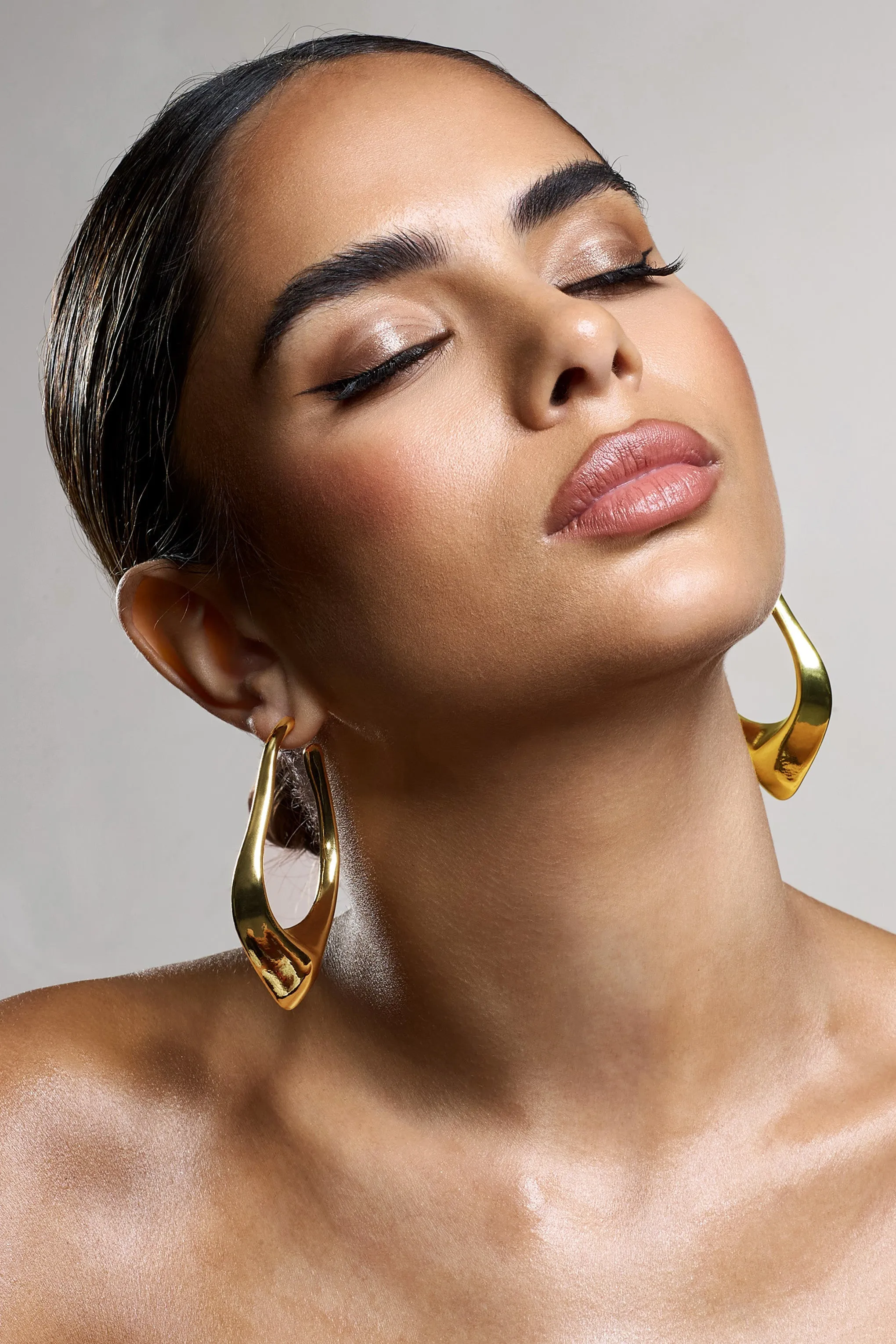 Tanzania | Gold Abstract Dangle Hoop Earrings sold by Club L London product image thumbnail 2