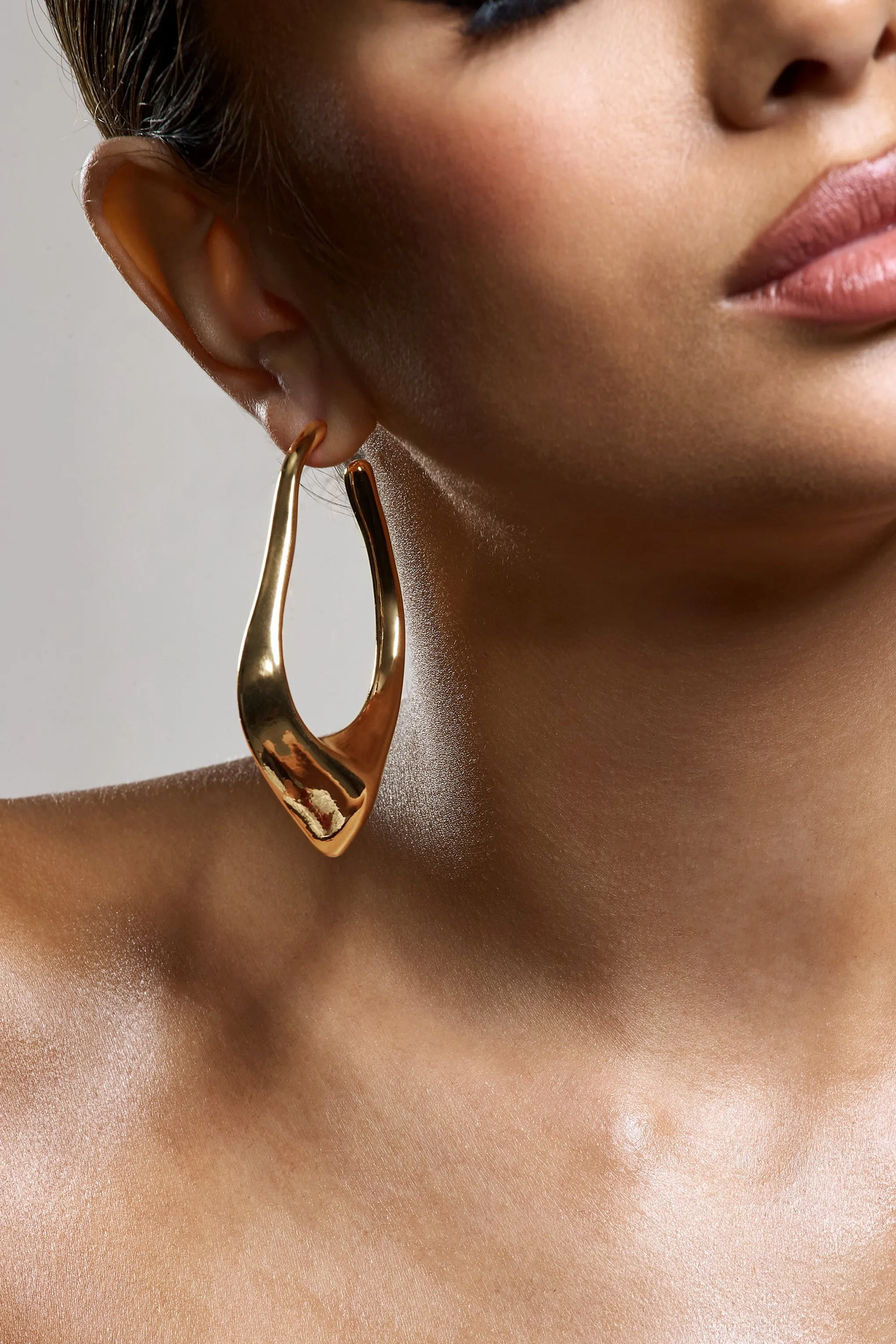 Tanzania | Gold Abstract Dangle Hoop Earrings sold by Club L London product image thumbnail 5