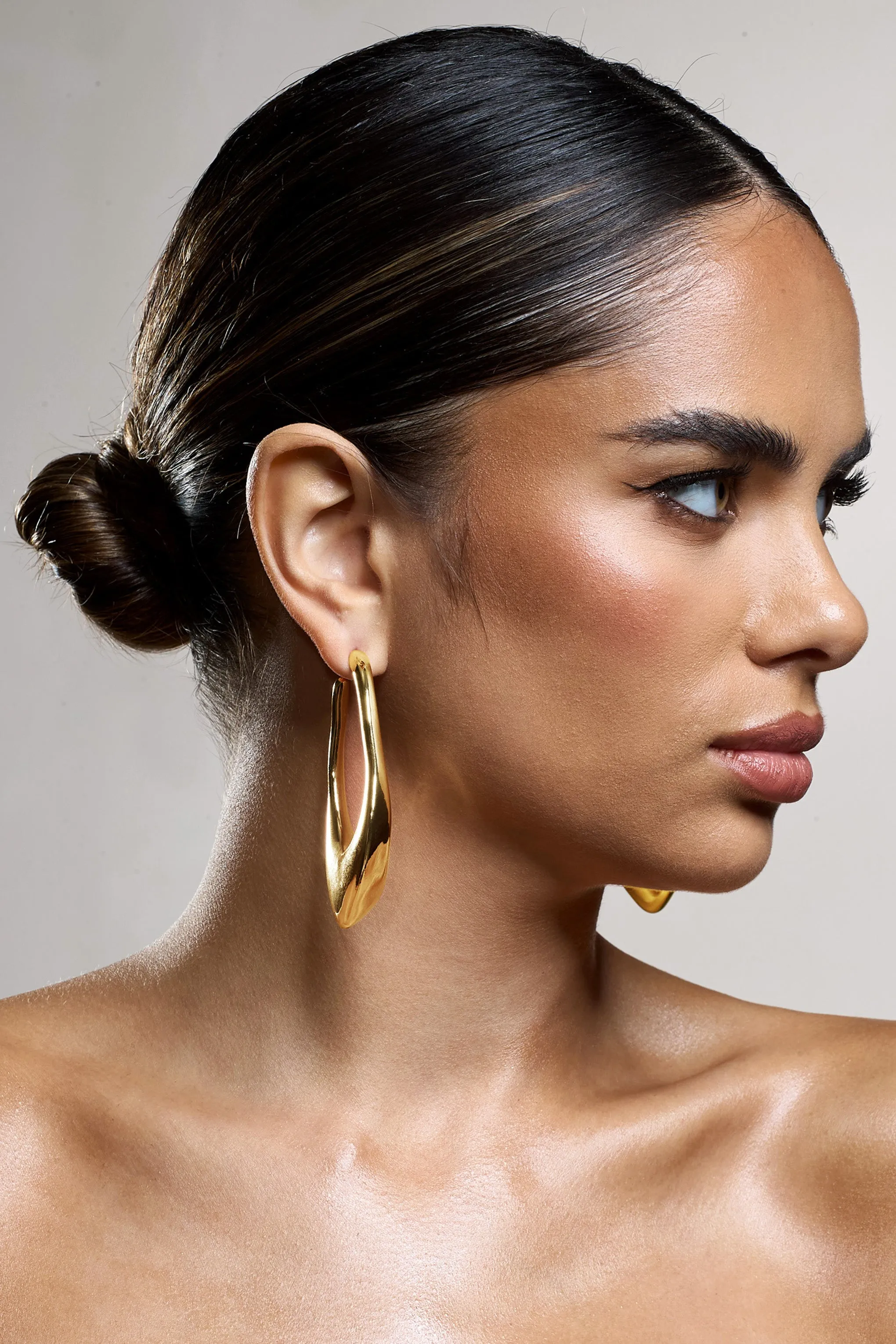 Tanzania | Gold Abstract Dangle Hoop Earrings sold by Club L London product image thumbnail 3