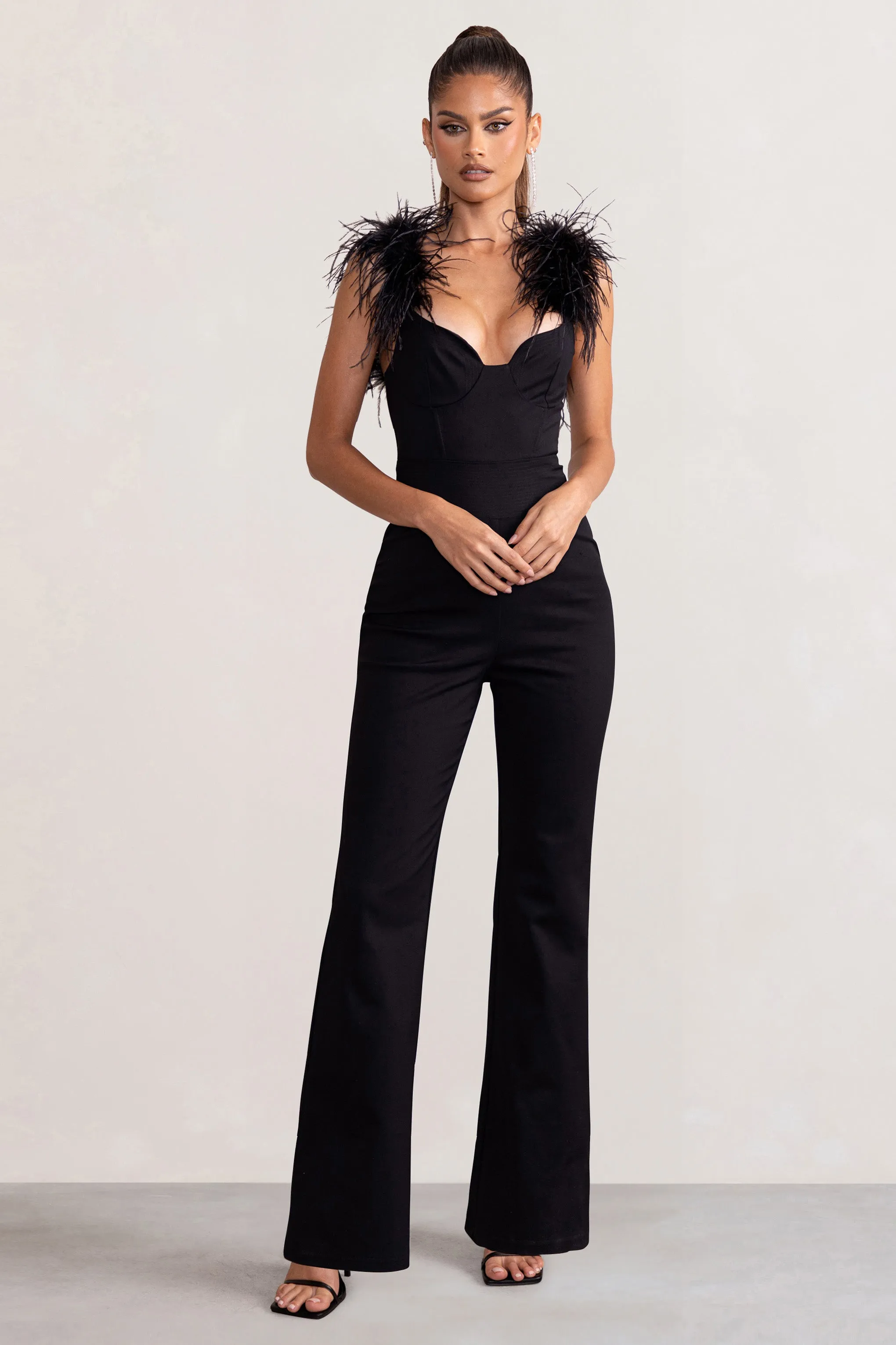 Verity | Black Feather Shoulder Corset Style Jumpsuit sold by Club L London
