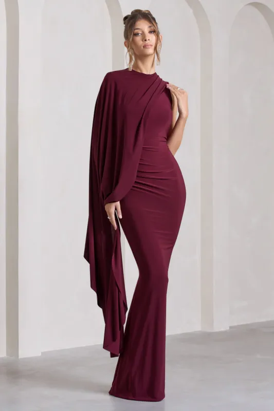 Unveil | Burgundy One-Sleeve Cape Maxi Dress sold by Club L London