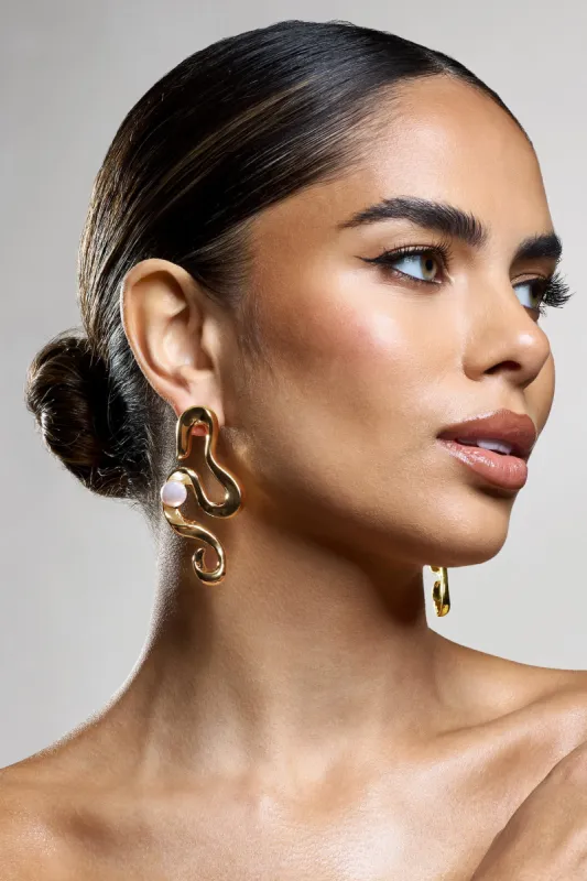 Rowan | Gold Twist Statement Pearl Earrings sold by Club L London