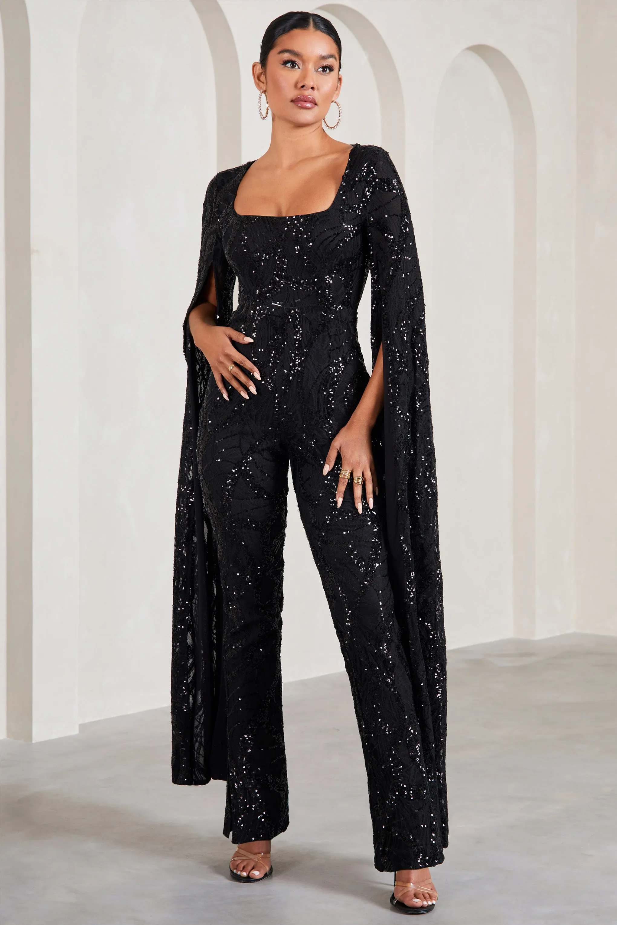 Cher | Black Sequin Lace Square-Neck Jumpsuit With Cape Sleeves sold by Club L London