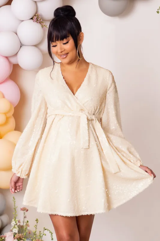 Blossoming | Cream Maternity Wrap Front Sequin Mini Dress sold by Club L London