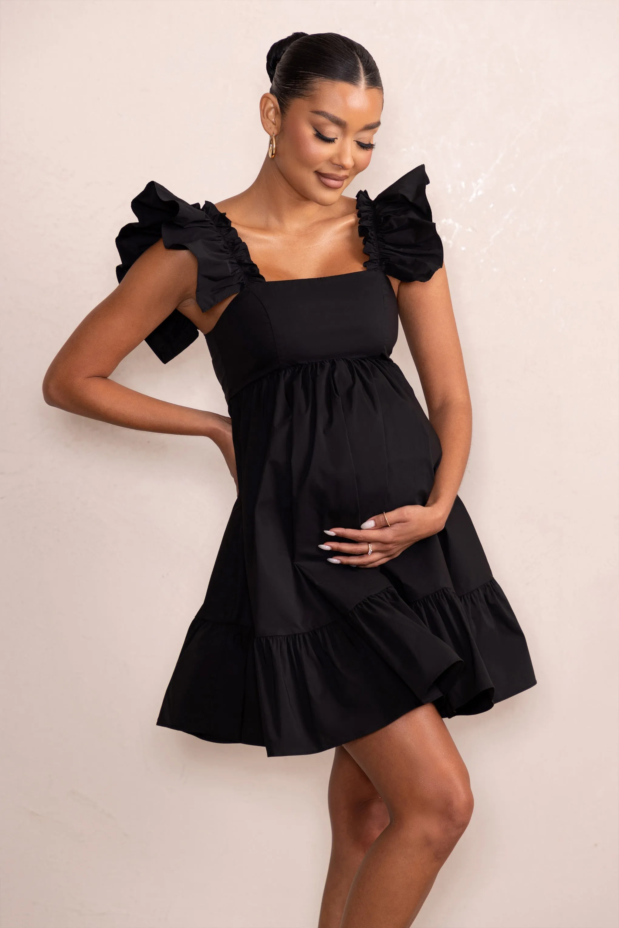 Dolly Daze | Black Maternity Ruffle Mini Dress sold by Club L London