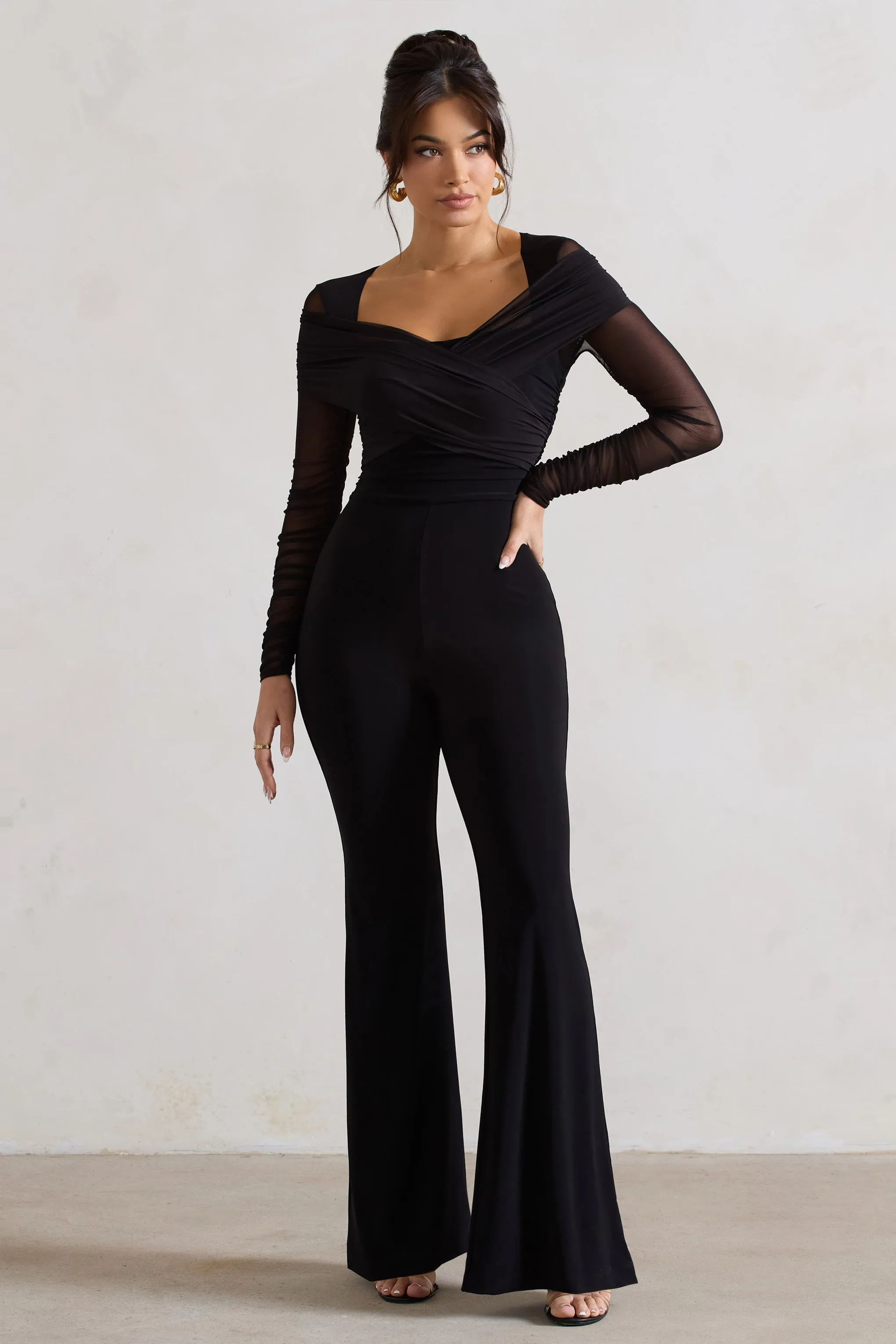 Crossed Lines | Black Ruched Mesh Flared-Leg Jumpsuit sold by Club L London