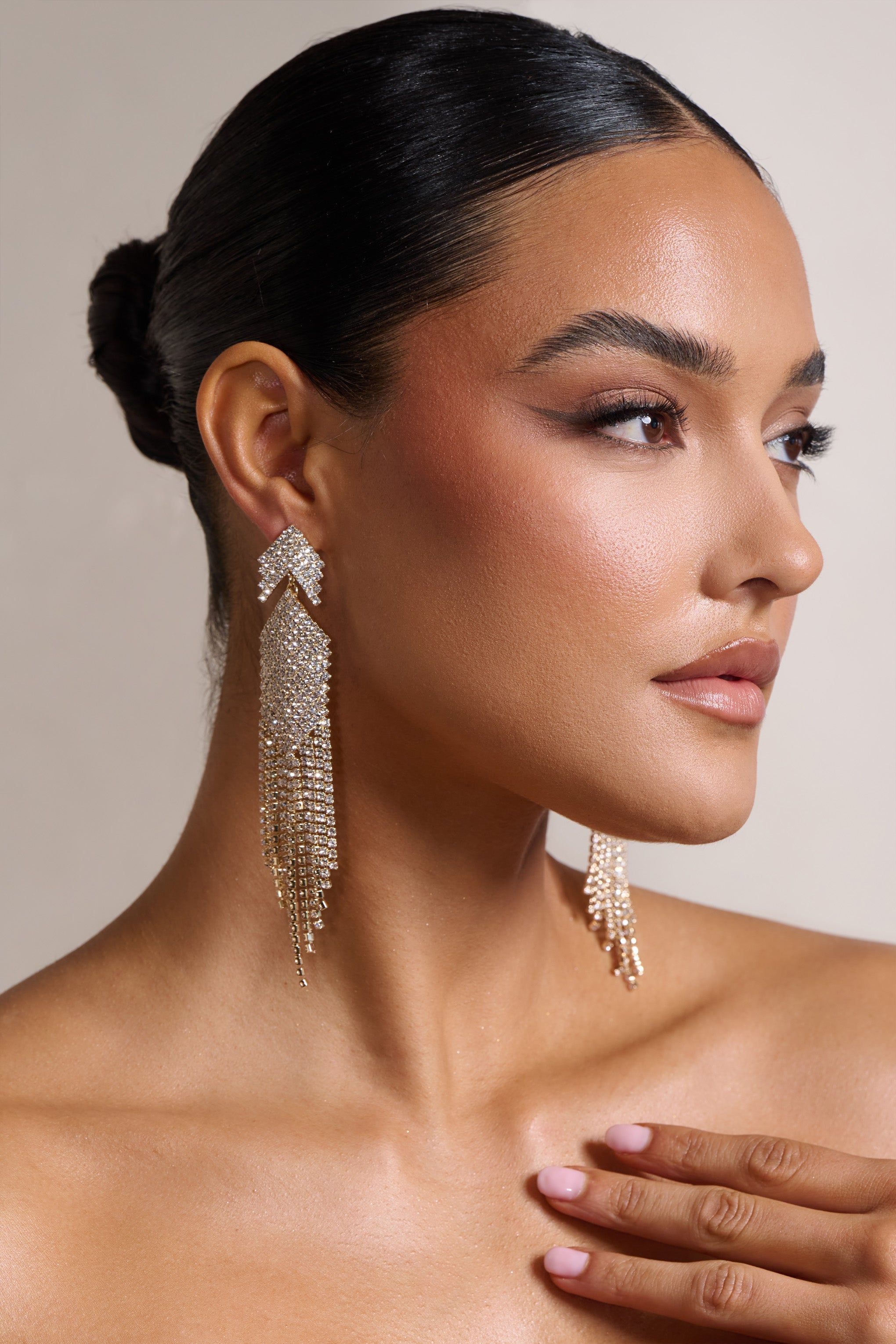 Gabbie | Gold Diamante Tassel Drop Earrings sold by Club L London