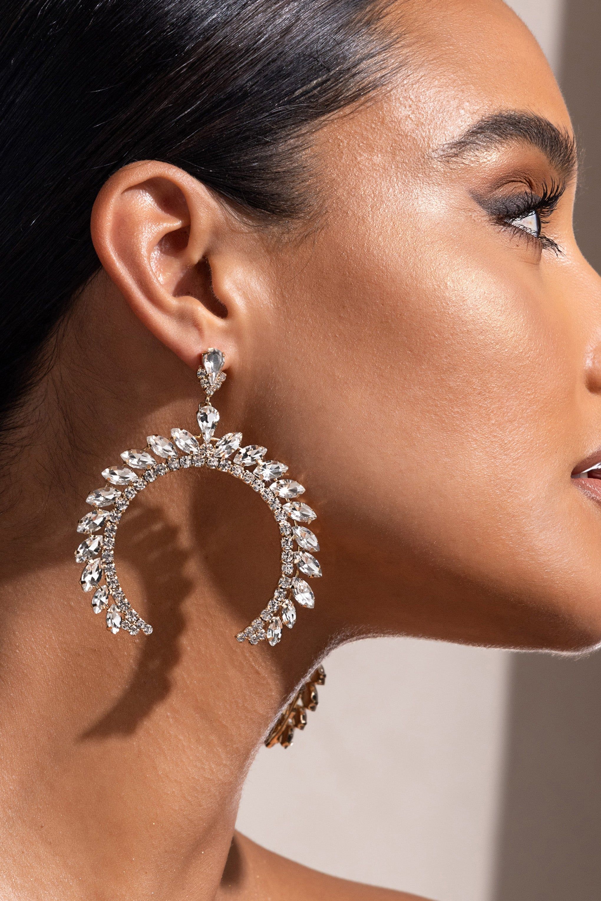 Eleonora | Gold Crystal Arched Shape Drop Earrings sold by Club L London product image thumbnail 2
