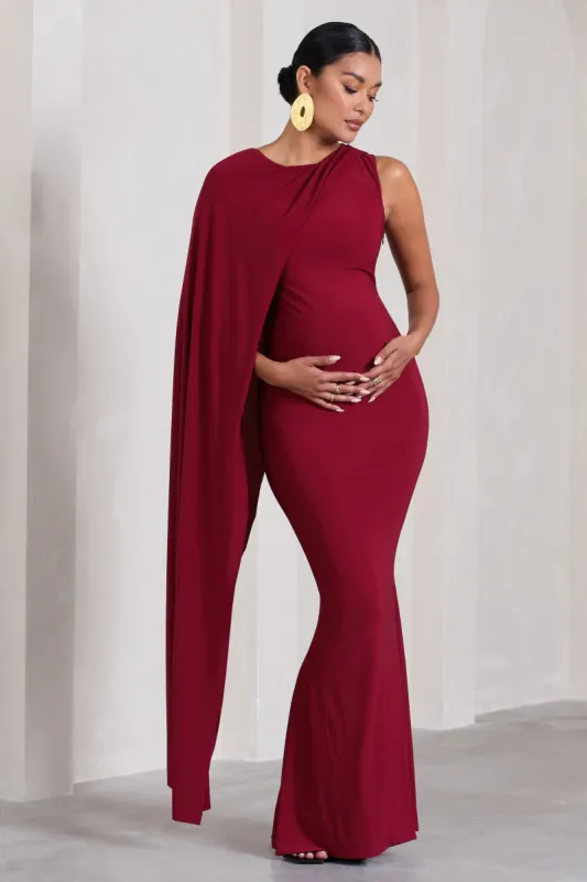 Unveil | Berry One-Sleeve Cape Maternity Maxi Dress sold by Club L London