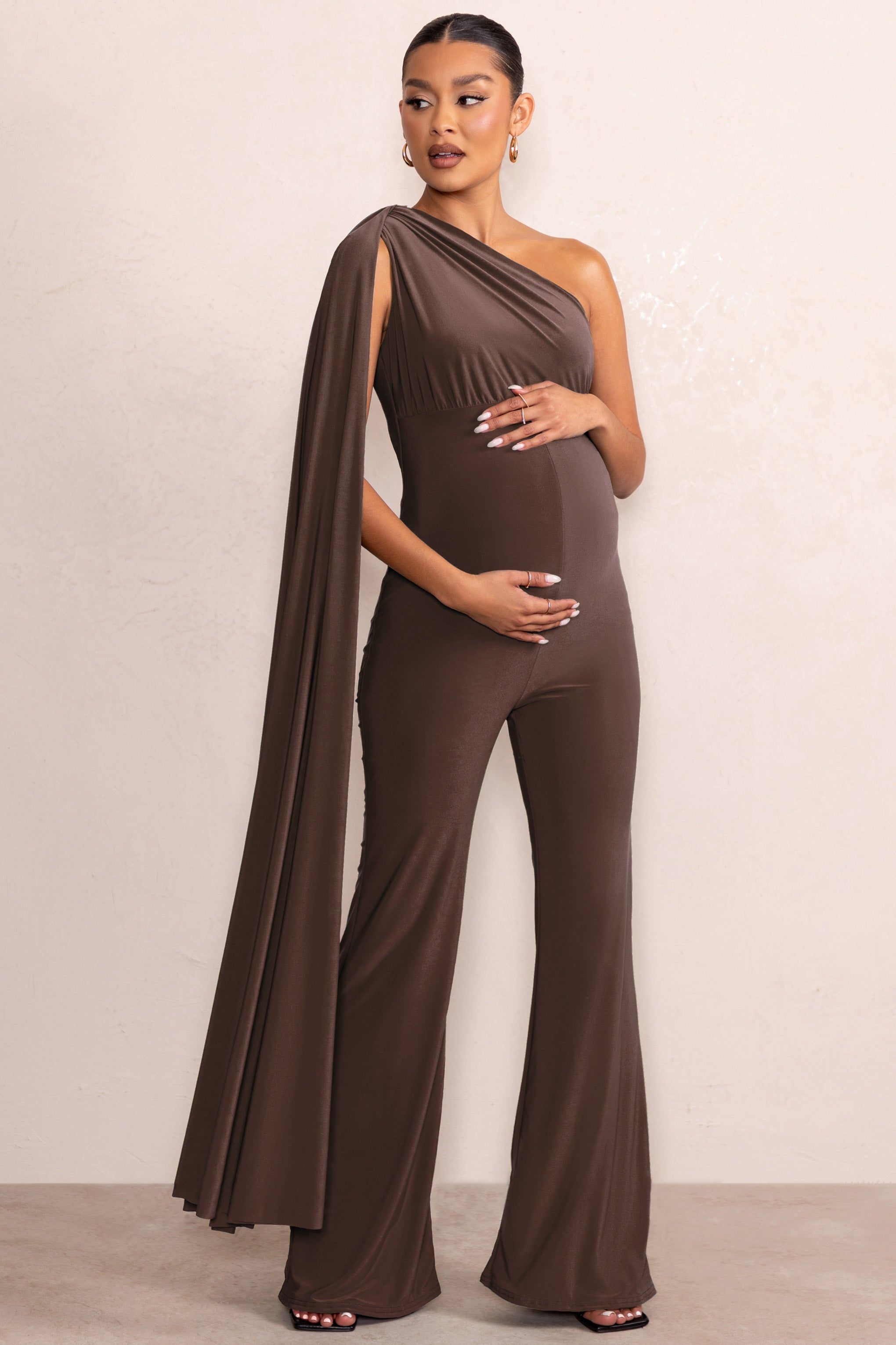 Sing To Sleep | Chocolate Maternity One Shoulder Cape Jumpsuit sold by Club L London