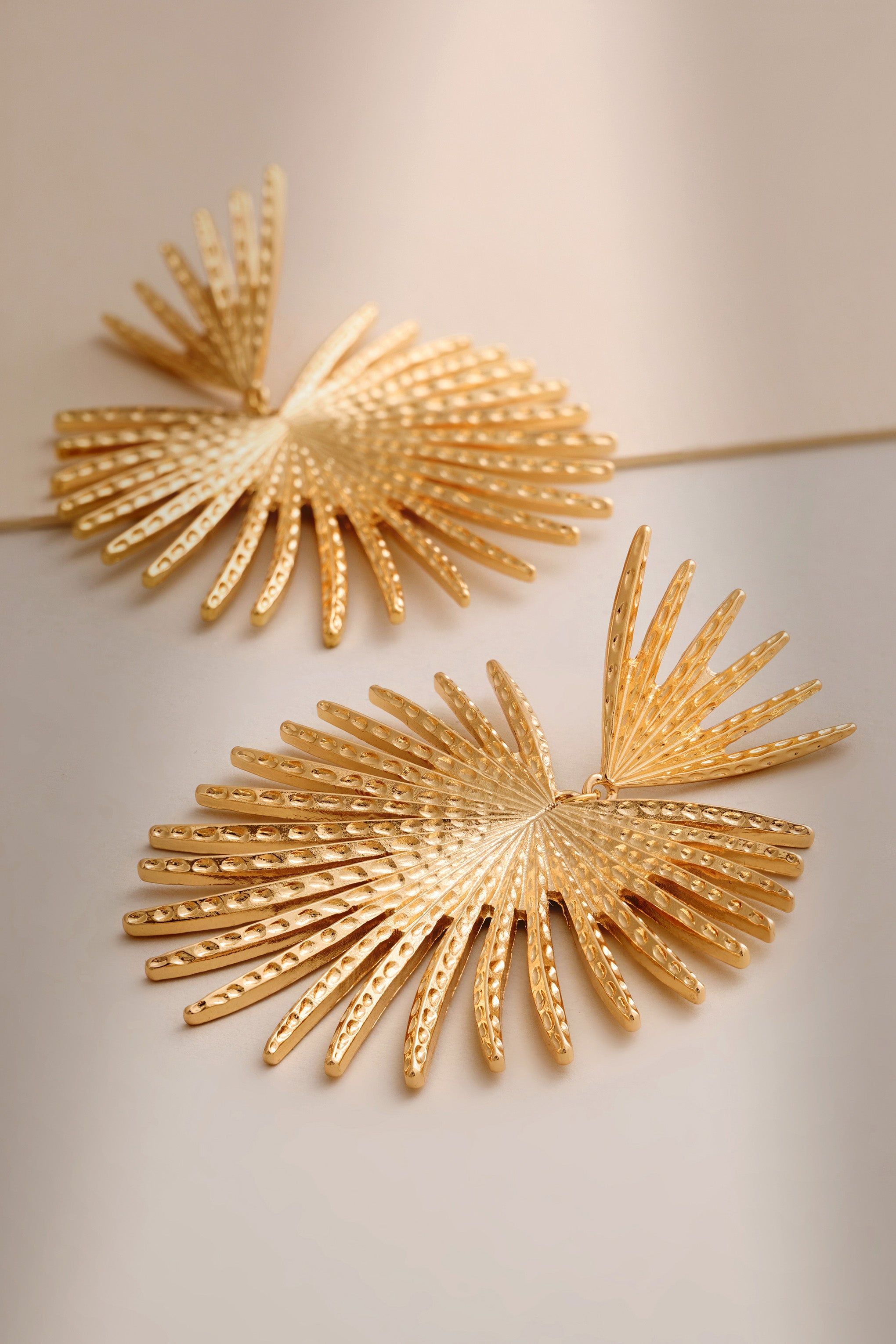 Amel | Gold Stardrop Earrings sold by Club L London
