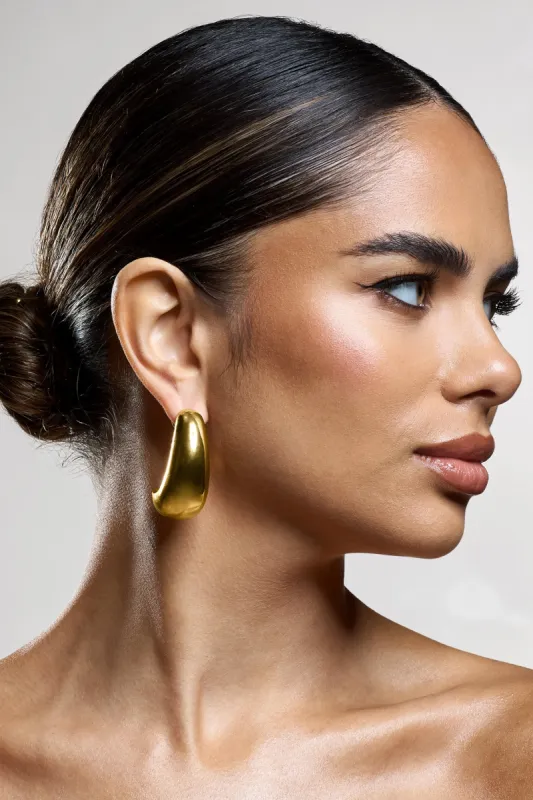 Levitate | Gold Chunky Dangle Earrings sold by Club L London