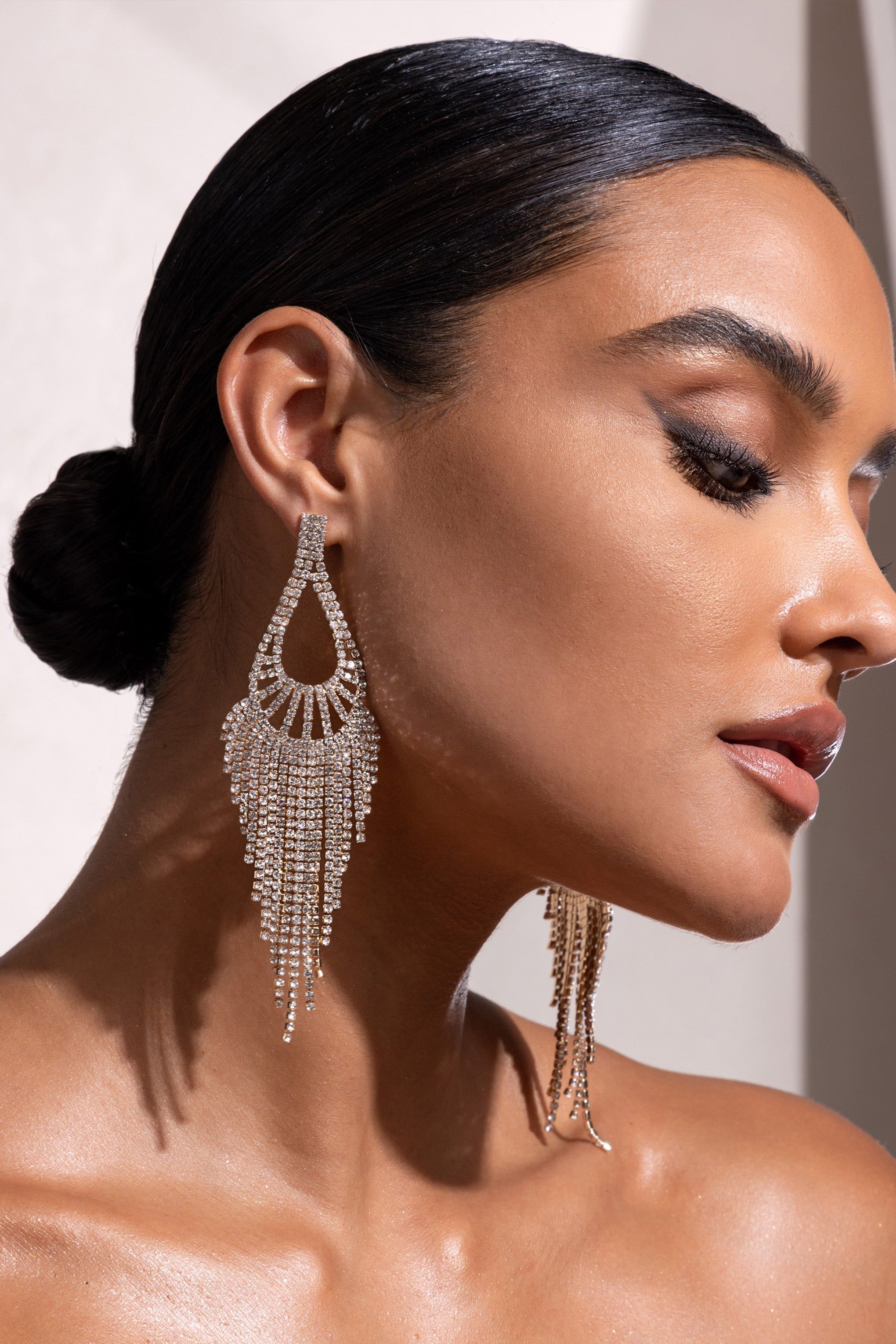Fiorenza | Gold Diamante Teardrop Tassel Earrings sold by Club L London