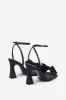 Headlines | Black Ankle Strap Heeled Sandals With Diamante Bows sold by Club L London
