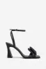 Headlines | Black Ankle Strap Heeled Sandals With Diamante Bows sold by Club L London