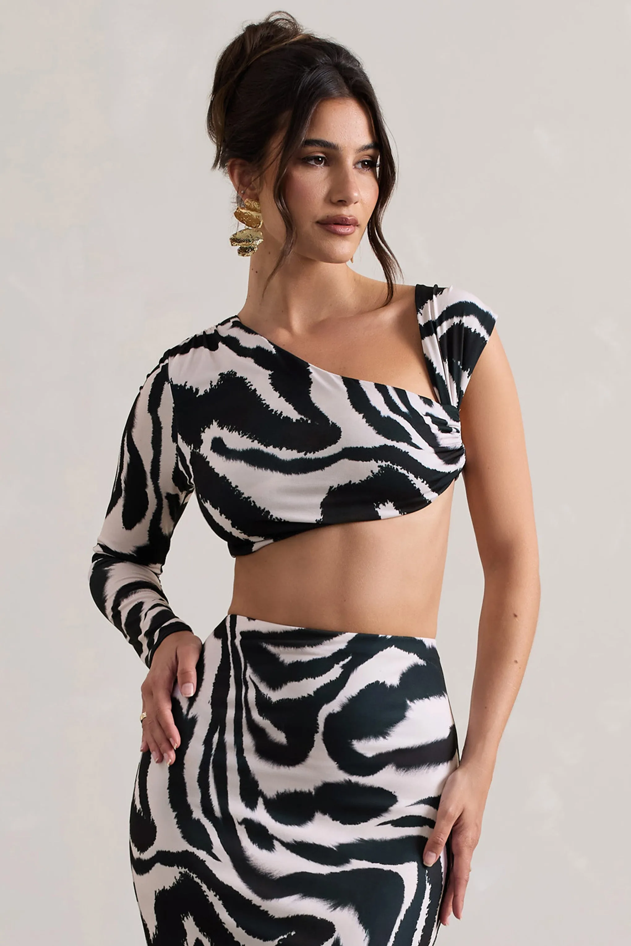 Agalia | Zebra Print Ruched Asymmetric One-Sleeve Crop Top sold by Club L London