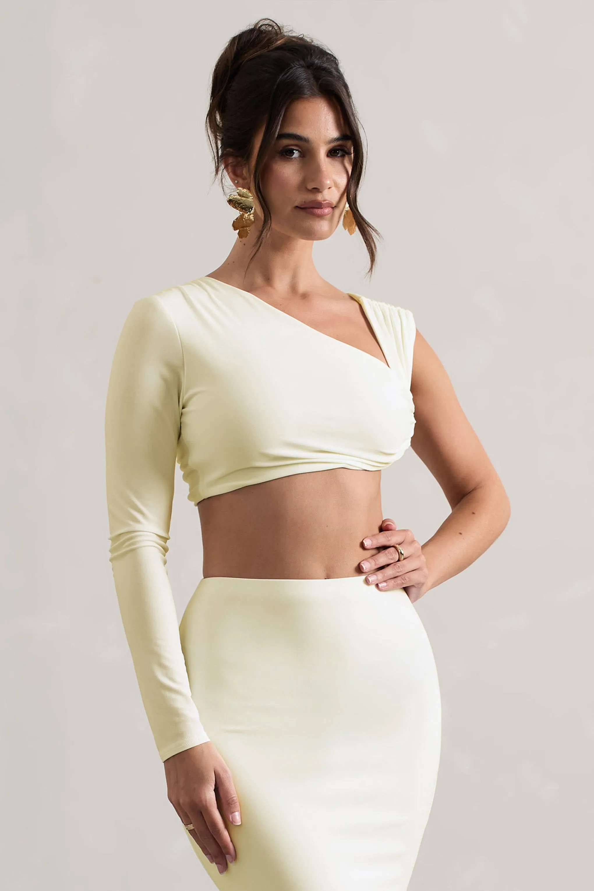 Agalia | Cream Ruched Asymmetric One-Sleeve Crop Top sold by Club L London