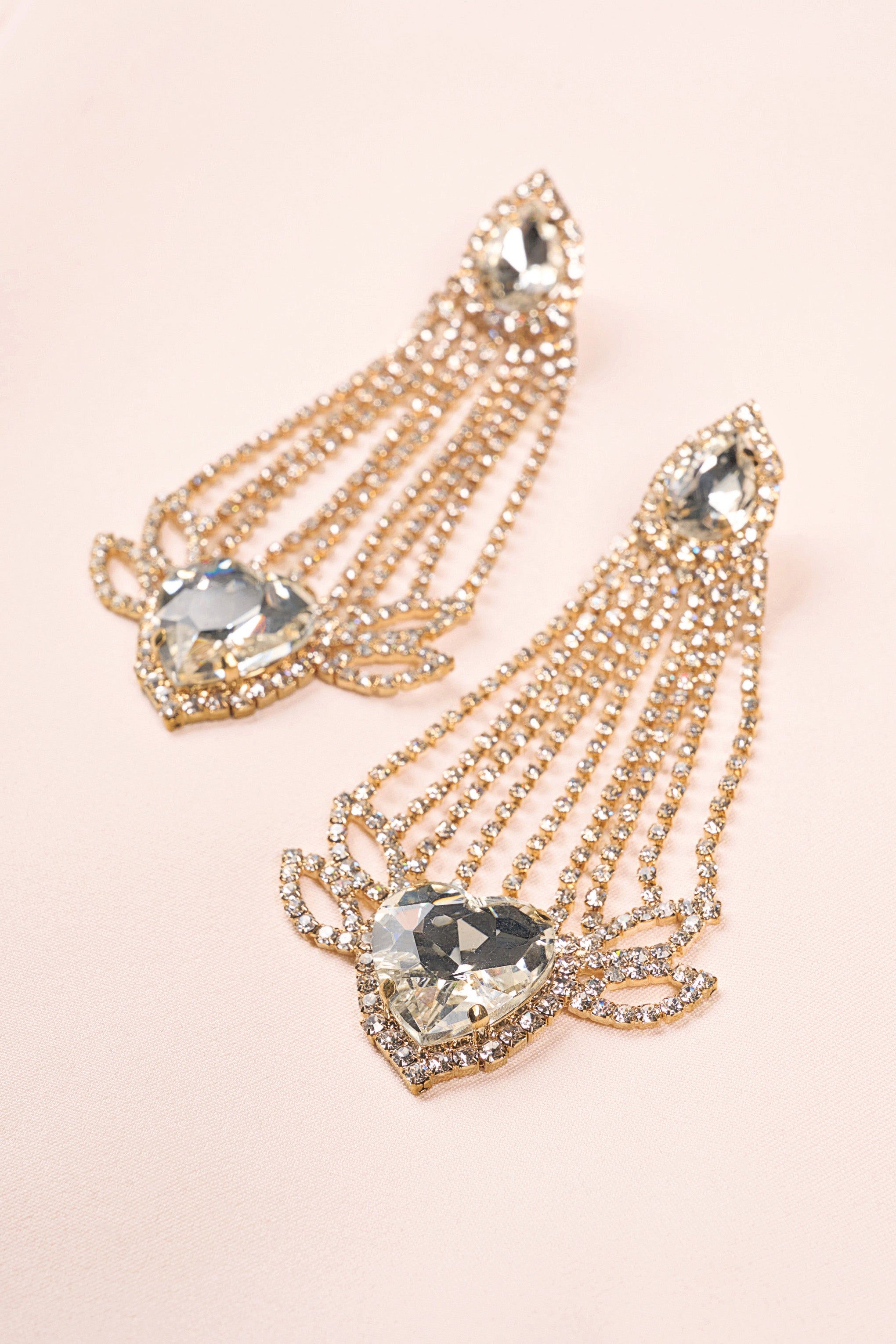 Fiorella | Gold Diamante Heart Crystal Shape Drop Earrings sold by Club L London