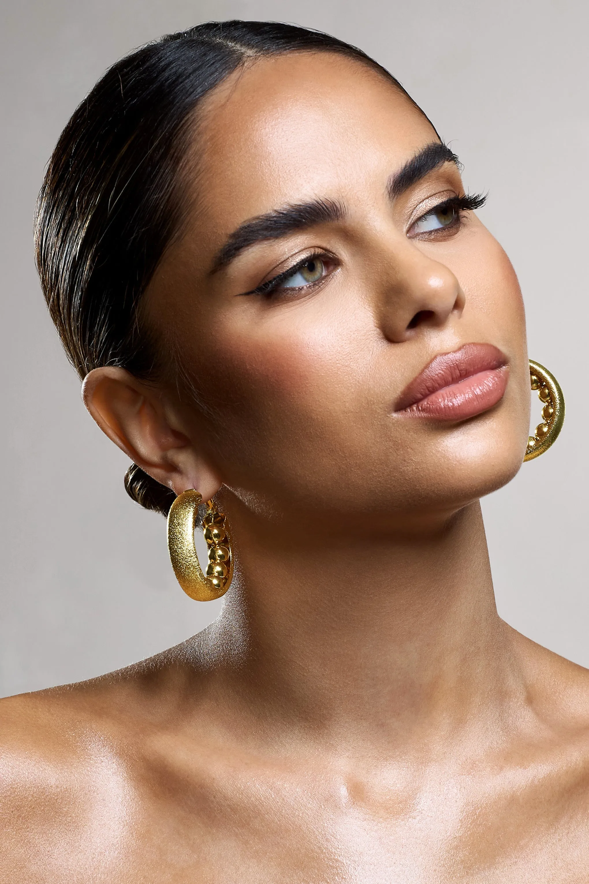 Portal | Gold Textured Chunky Hoop Earrings sold by Club L London product image thumbnail 2