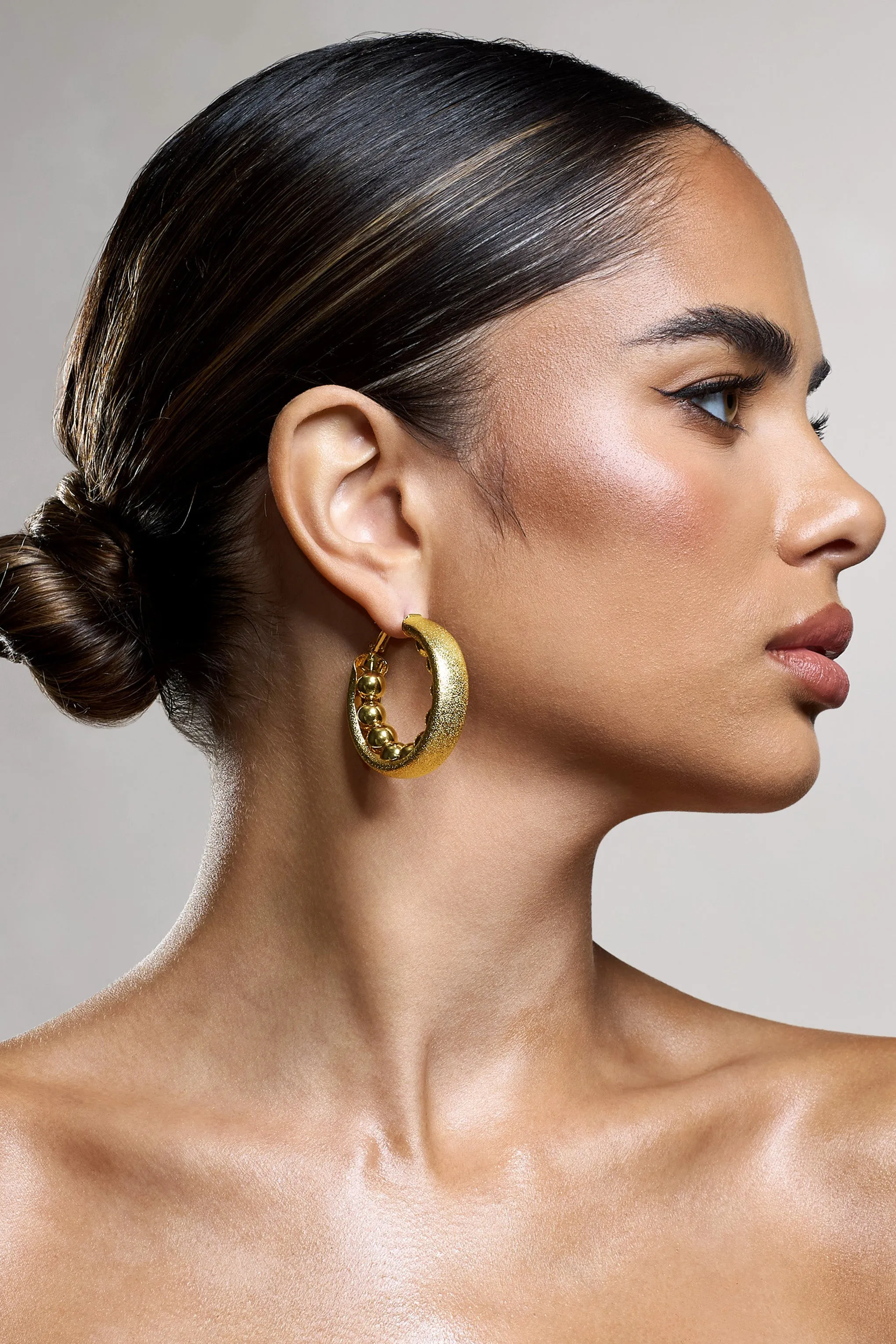 Portal | Gold Textured Chunky Hoop Earrings sold by Club L London product image thumbnail 5