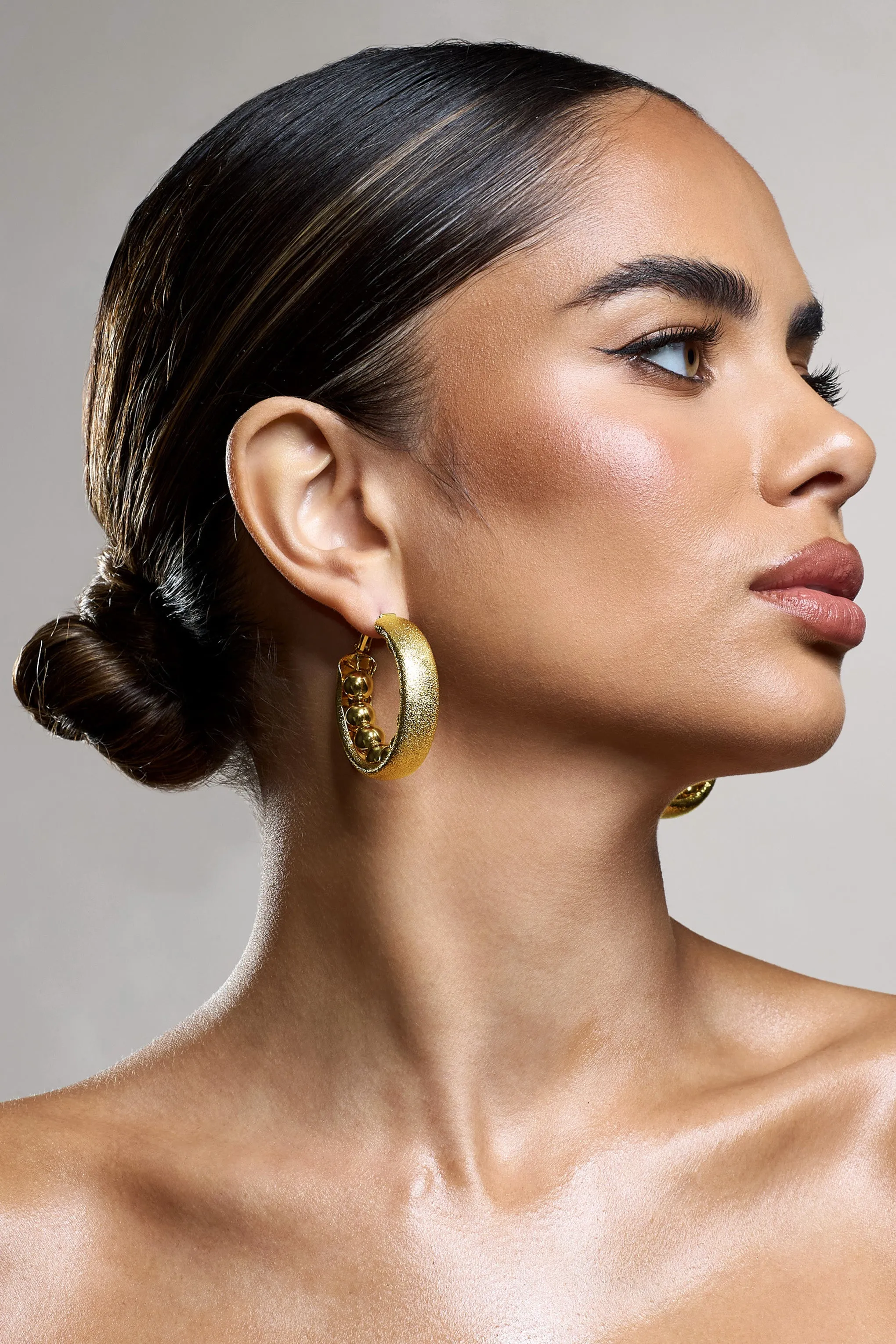 Portal | Gold Textured Chunky Hoop Earrings sold by Club L London product image thumbnail 3